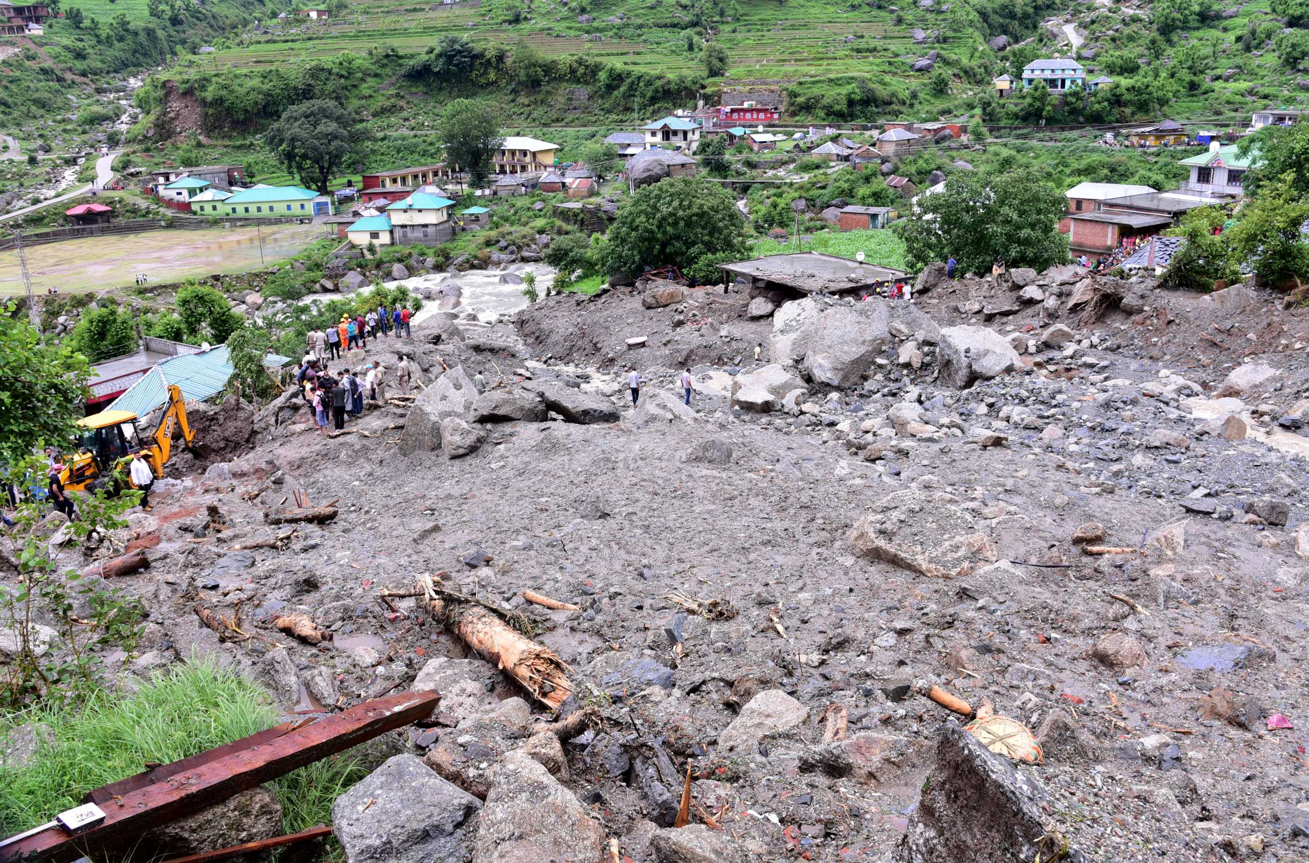 Rescue workers search for survivors after a landslide caused by heavy rains at Rulehar village in the Kangra district of the northern state of Himachal Pradesh, India, July 13, 2021. REUTERS