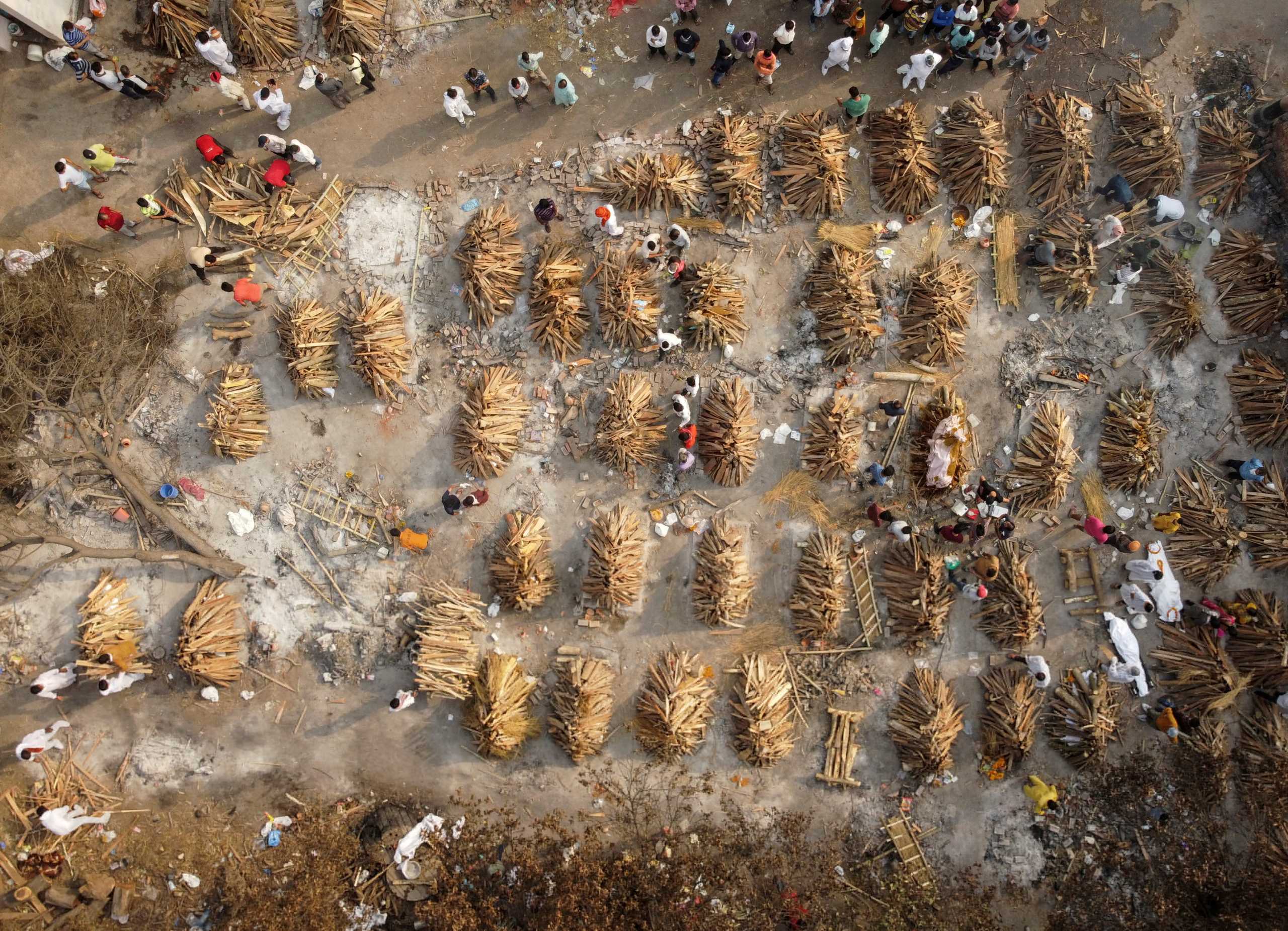 FILE PHOTO: The grounds are prepared for mass cremation of coronavirus disease (COVID-19) victims in New Delhi, India, April 28, 2021. Picture taken with a drone. REUTERS