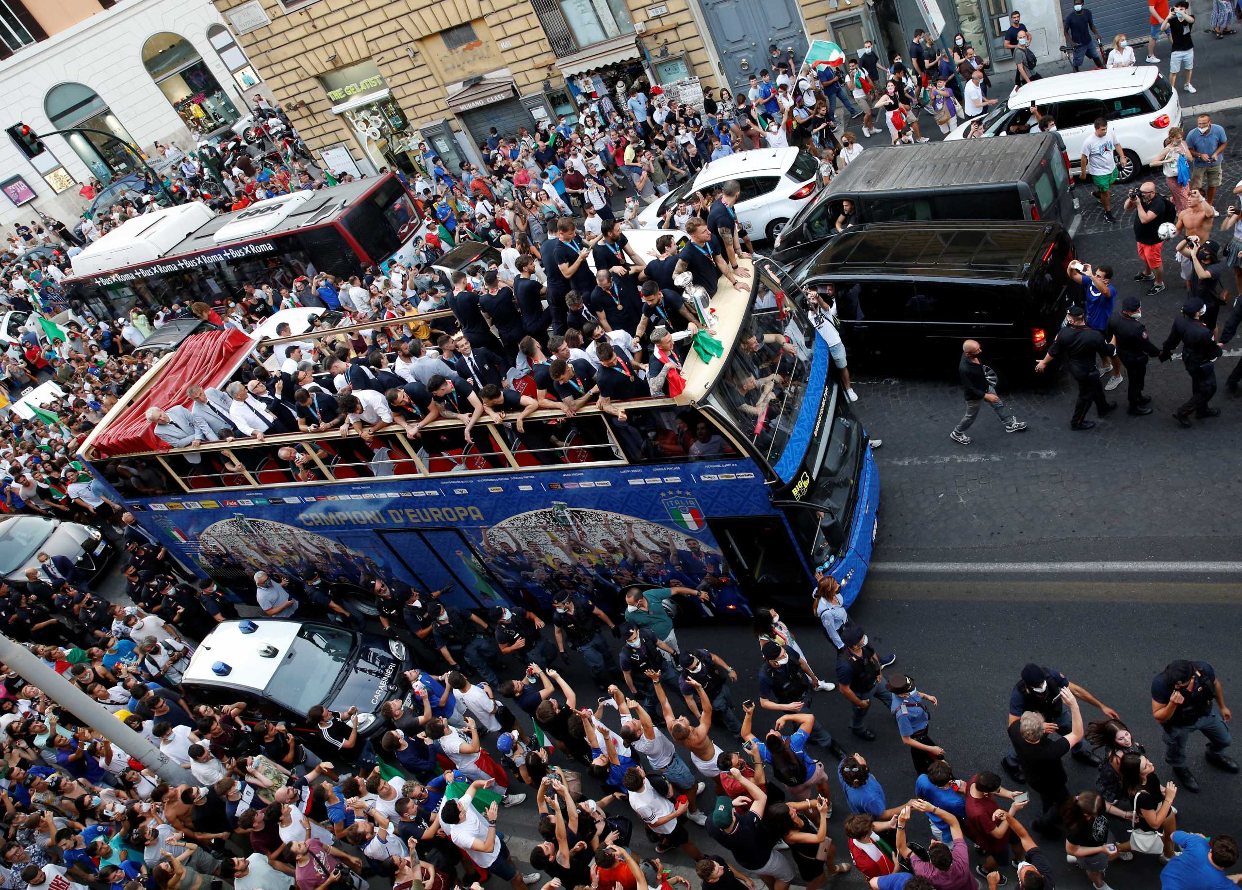 FILE PHOTO: Soccer Football - Euros 2020 - The Italy team drive through Rome on a open top bus tour amidst celebrating fans after winning the Euros 2020, July 12, 2021. REUTERS