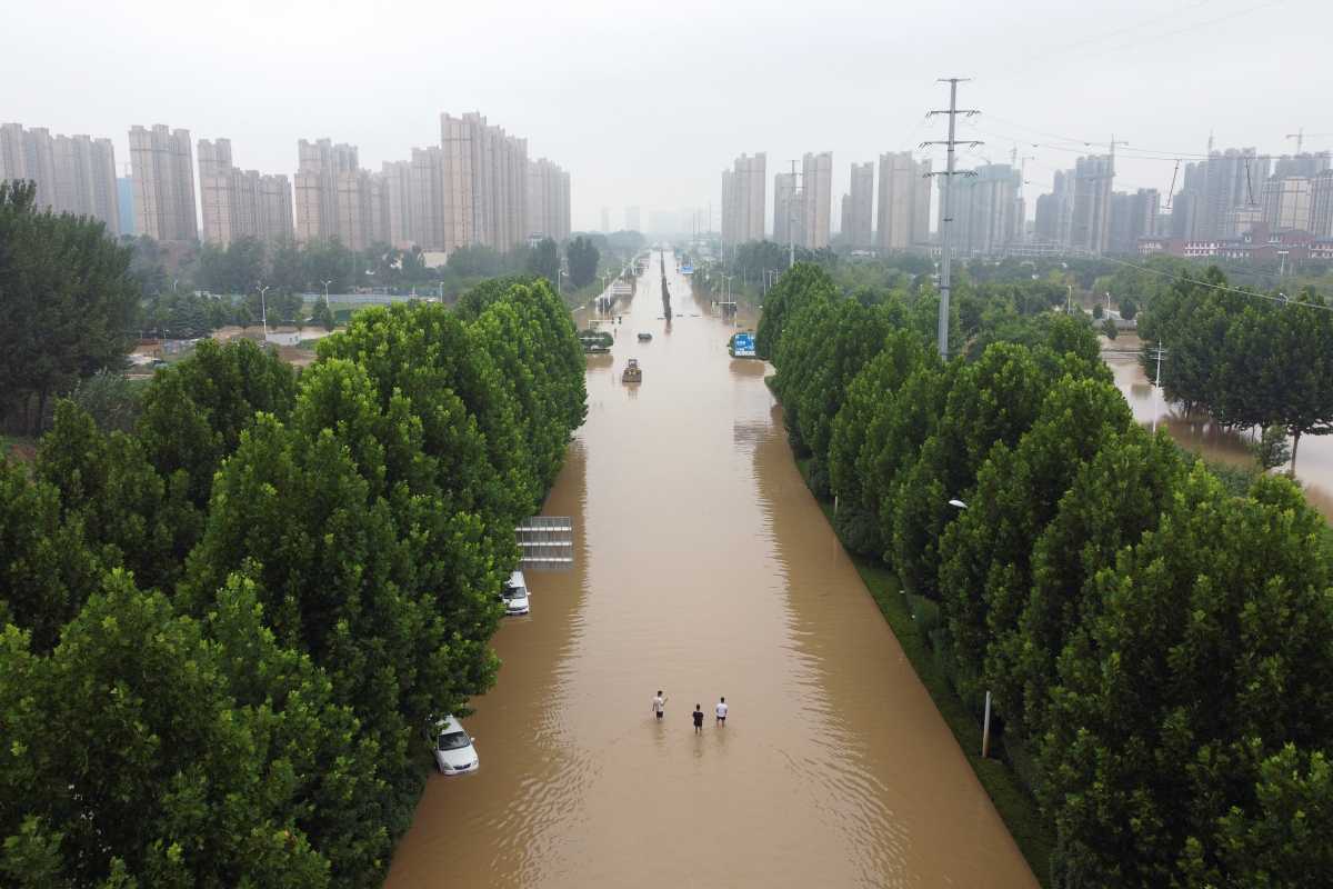 An aerial view shows a flooded road following heavy rainfall in Zhengzhou, Henan province, China July 23, 2021. Picture taken with a drone. REUTERS