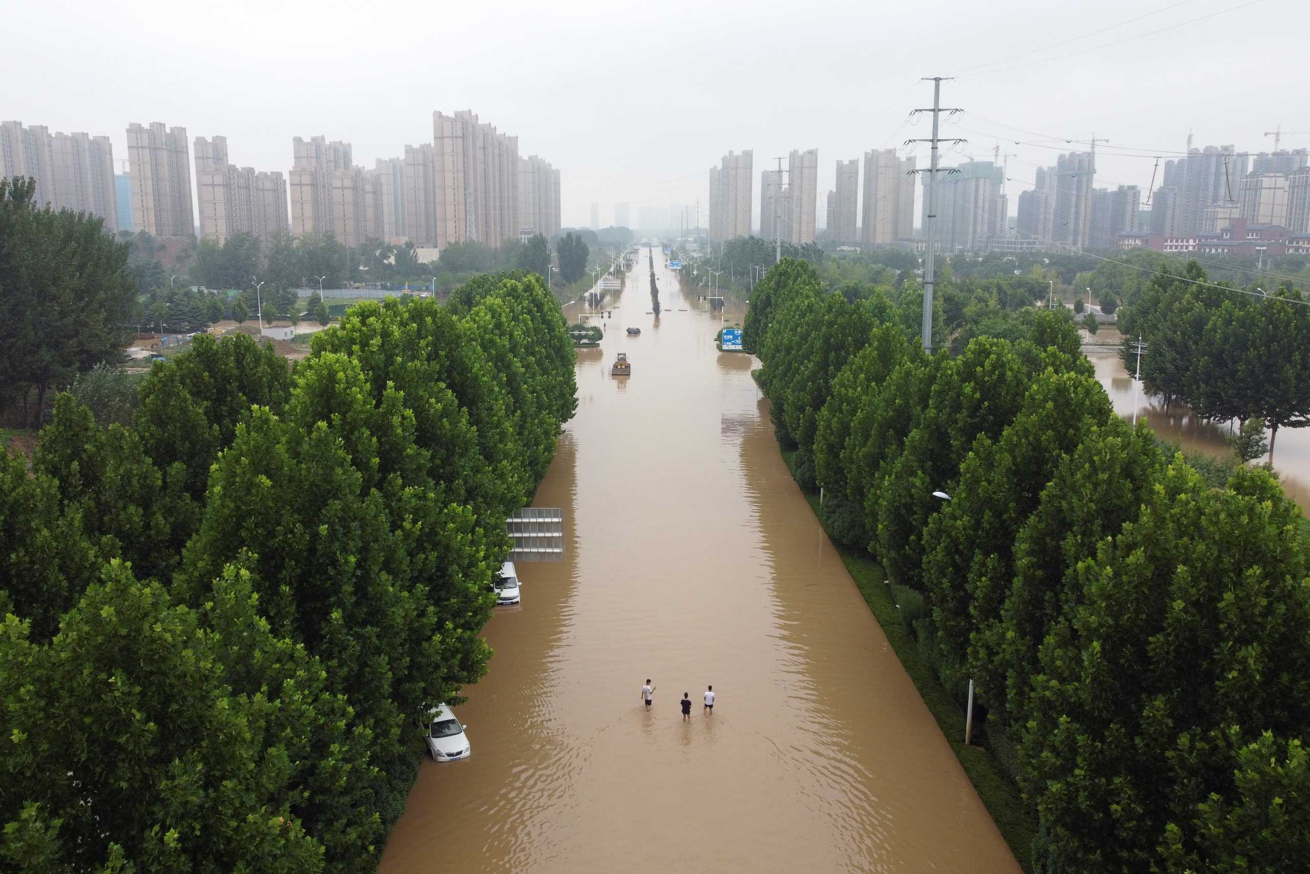 An aerial view shows a flooded road following heavy rainfall in Zhengzhou, Henan province, China July 23, 2021. Picture taken with a drone. REUTERS