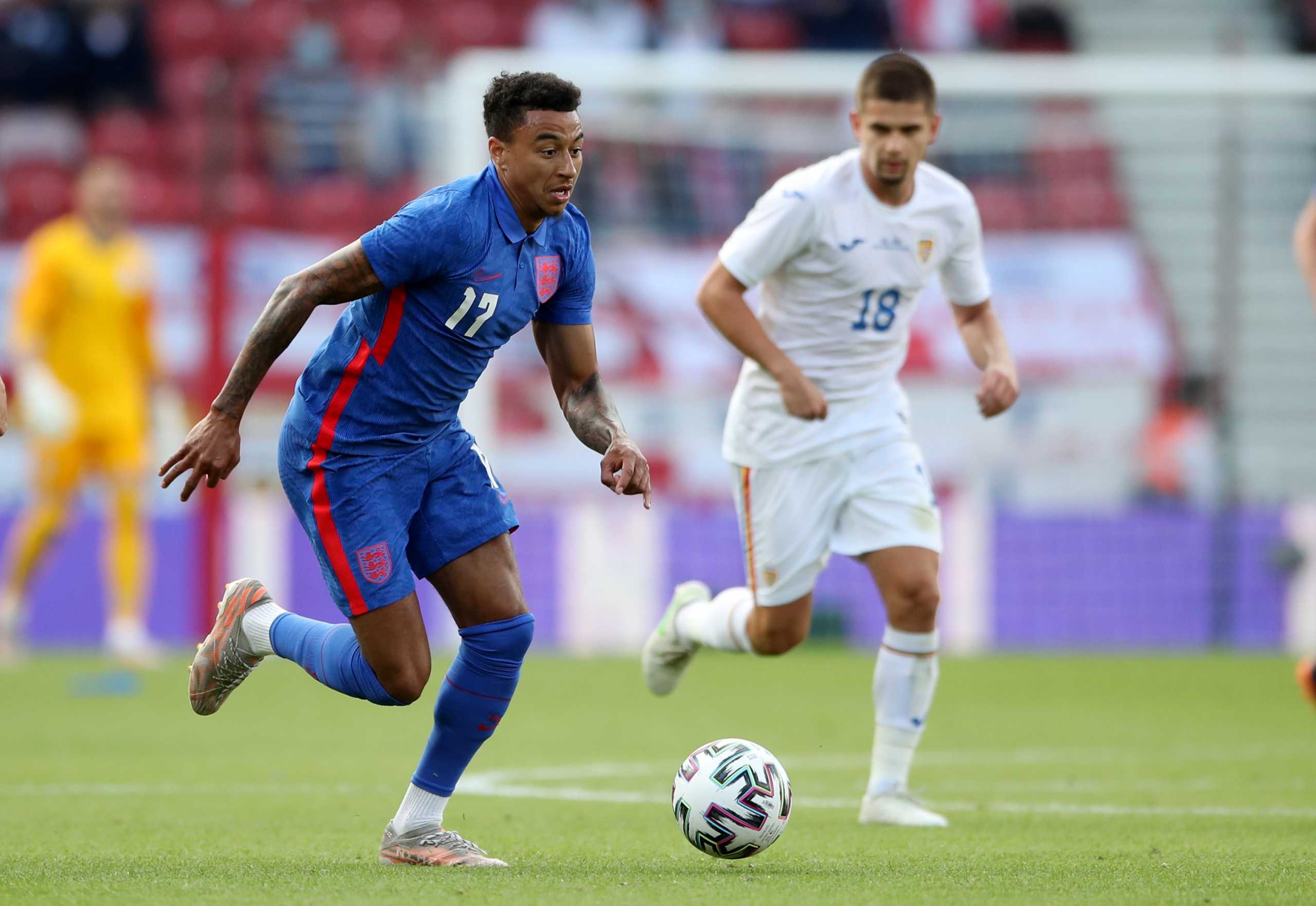 Soccer Football - International Friendly - England v Romania - Riverside Stadium, Middlesbrough, Britain - June 6, 2021 England's Jesse Lingard in action with Romania's Razvan Marin Pool via REUTERS