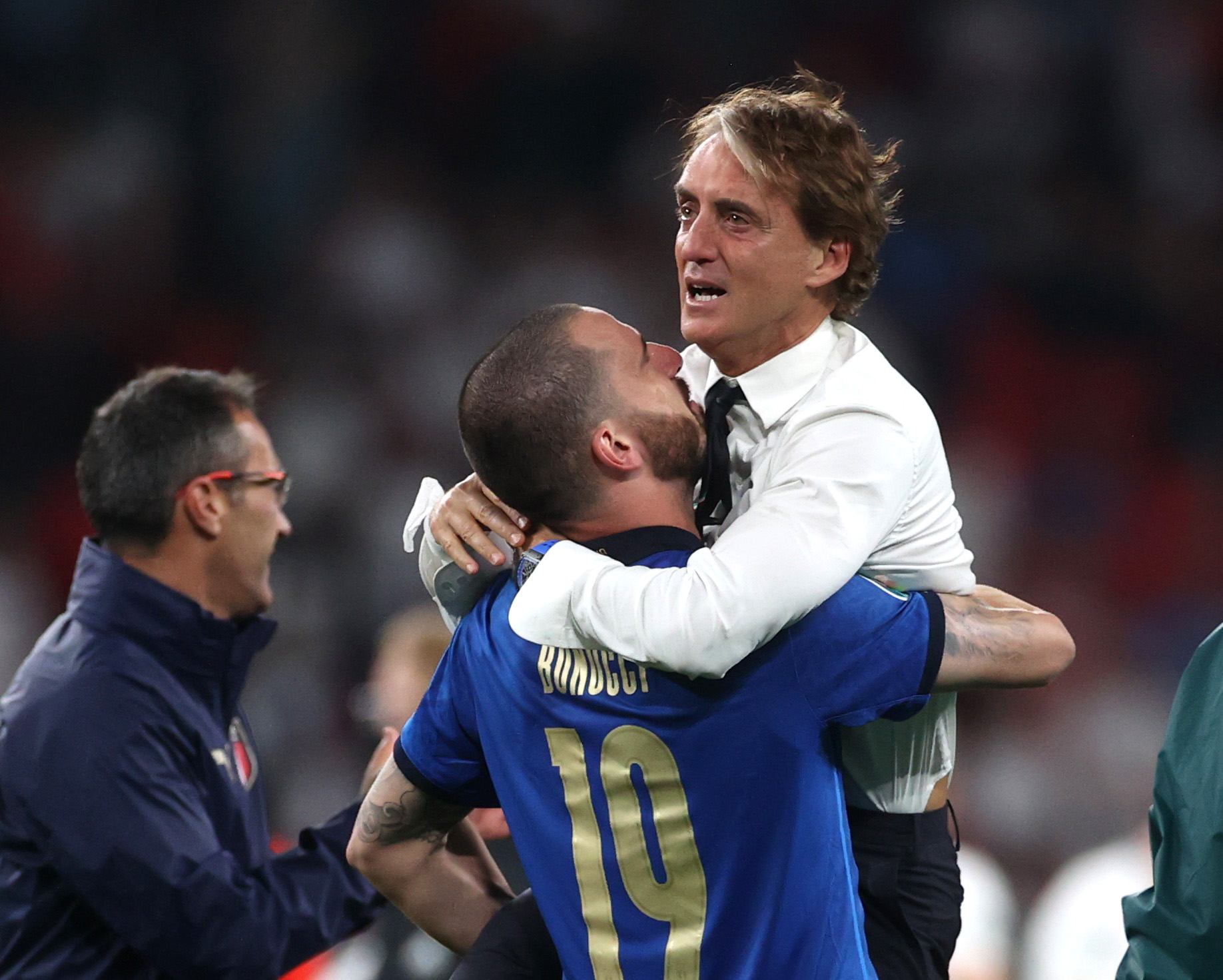 Soccer Football - Euro 2020 - Final - Italy v England - Wembley Stadium, London, Britain - July 11, 2021  Italy coach Roberto Mancini and Leonardo Bonucci celebrate after winning Euro 2020 after a penalty shootout Pool via REUTERS