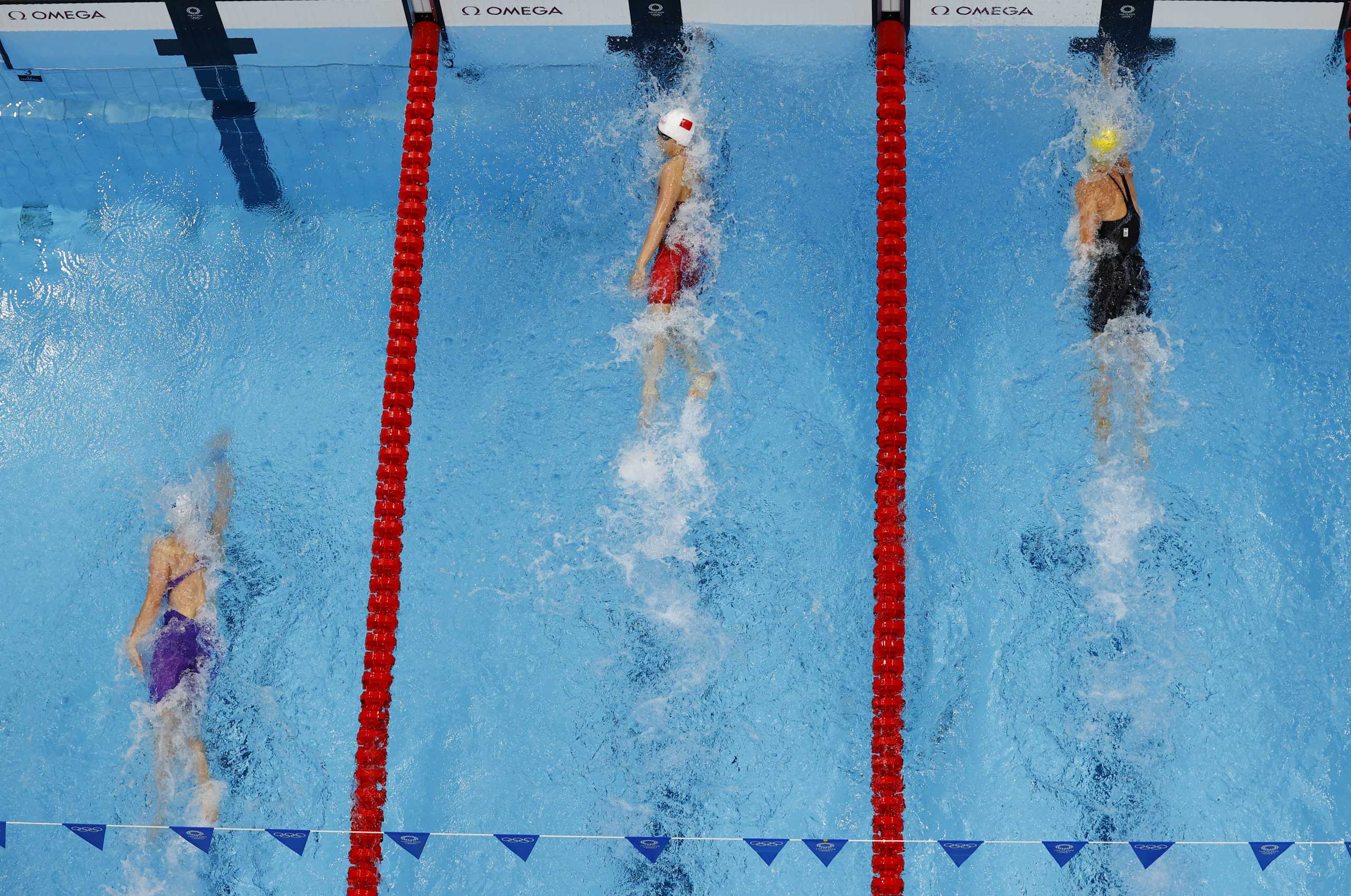 Tokyo 2020 Olympics - Swimming - Mixed 4 x 100m Medley Relay - Heats - Tokyo Aquatics Centre - Tokyo, Japan - July 29, 2021. Team Russian Olympic Committee, Team China and Team Australia in action REUTERS