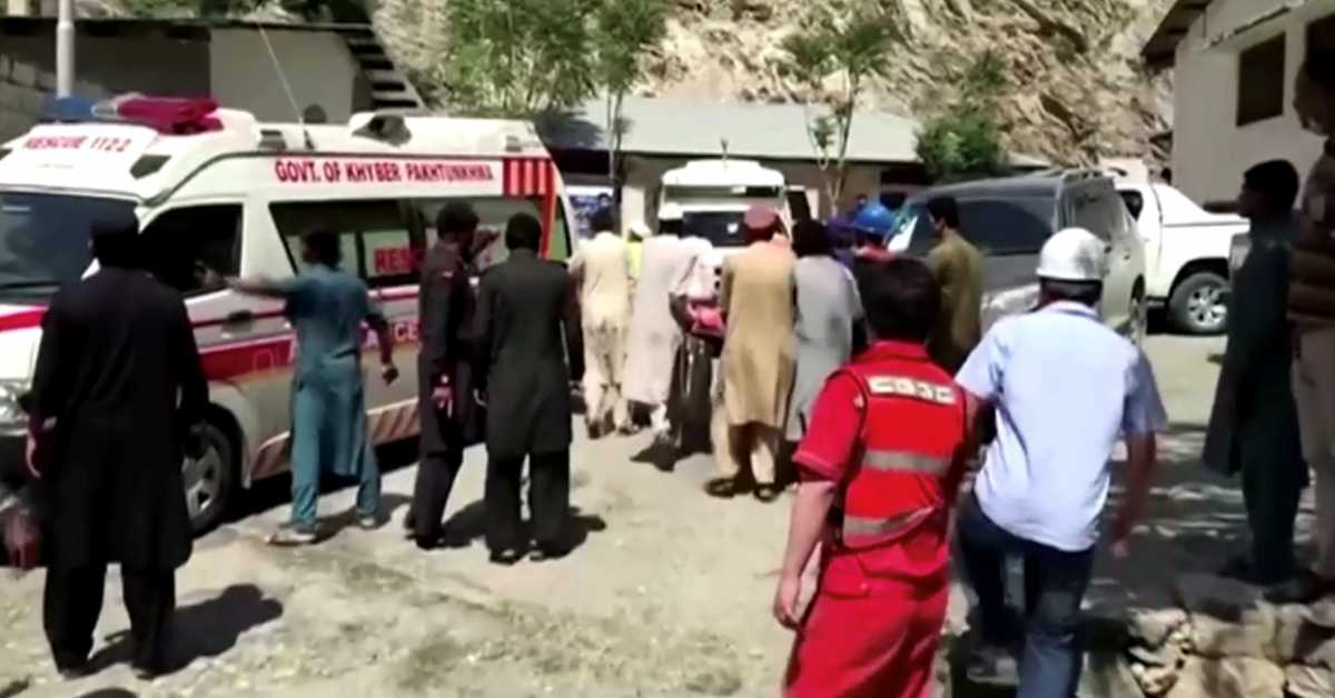 People wheel a gurney towards an ambulance outside a hospital in Dasu, after a bus with Chinese nationals on board plunged into a ravine in Upper Kohistan following a blast, Pakistan July 14, 2021 in this still image taken from video.  REUTERS