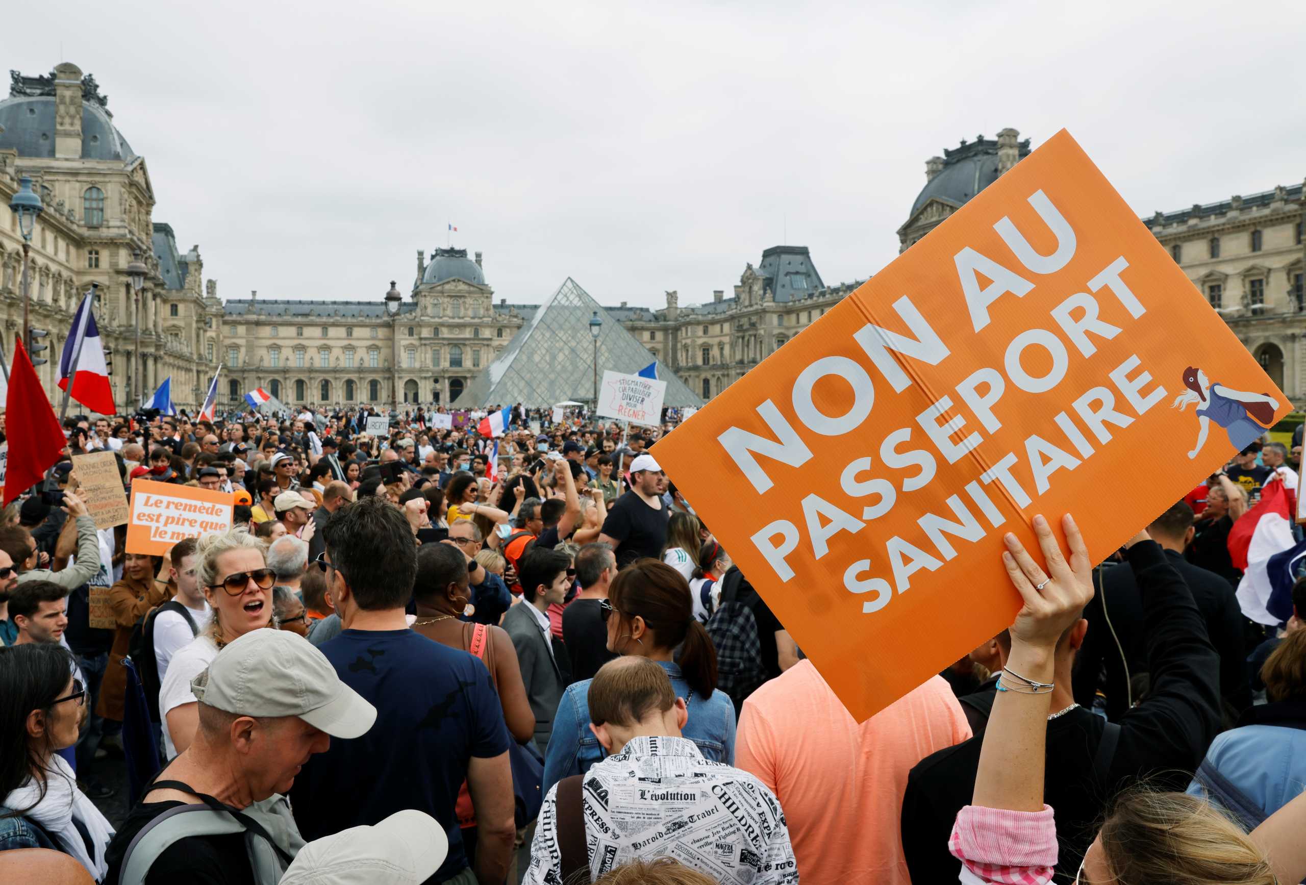 Demonstrators attend a protest against the new measures announced by French President Emmanuel Macron to fight the coronavirus disease (COVID-19) outbreak, in Paris, France, July 17, 2021. REUTERS