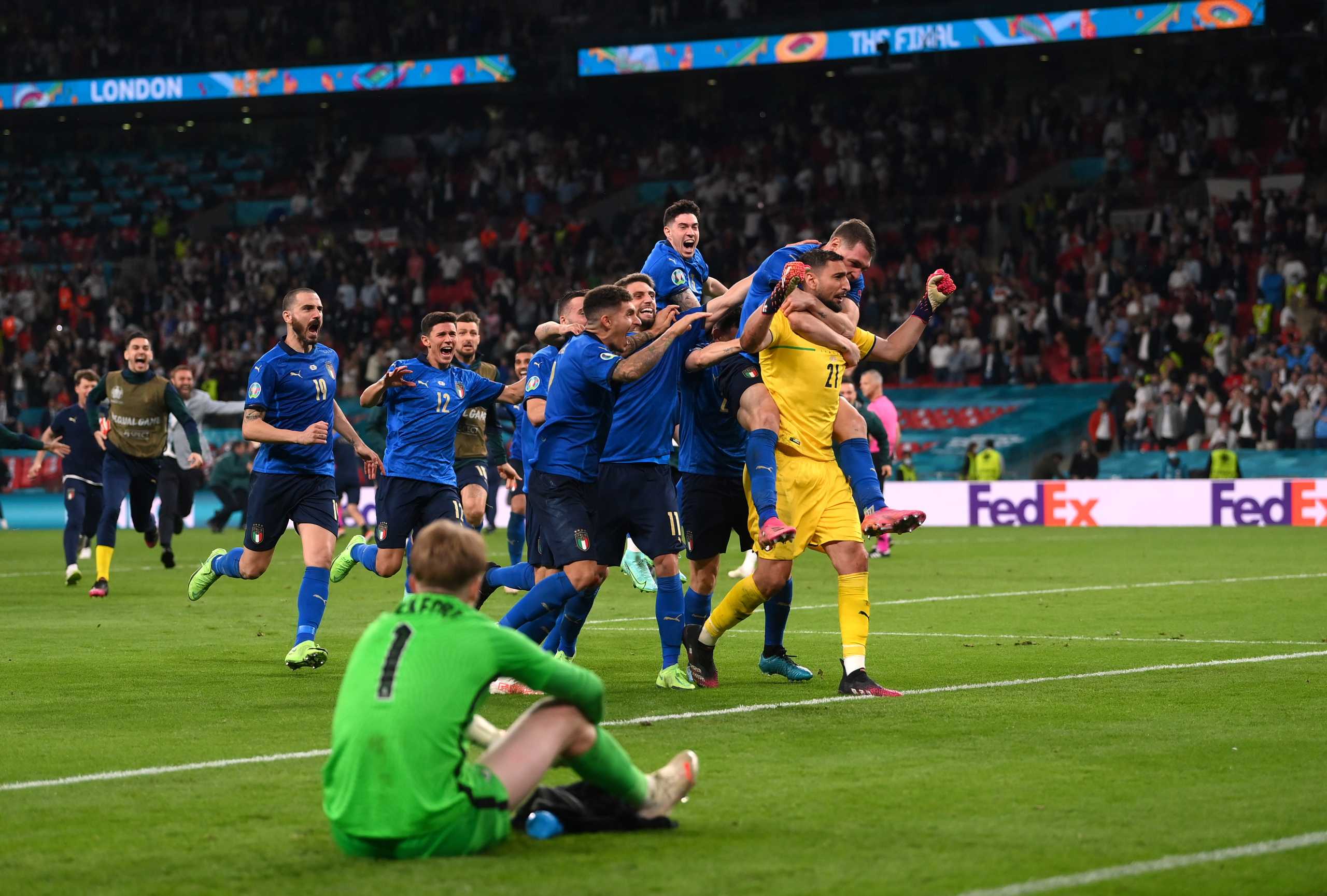 Soccer Football - Euro 2020 - Final - Italy v England - Wembley Stadium, London, Britain - July 11, 2021 Italy's Gianluigi Donnarumma celebrates winning Euro 2020 with teammates Pool via REUTERS