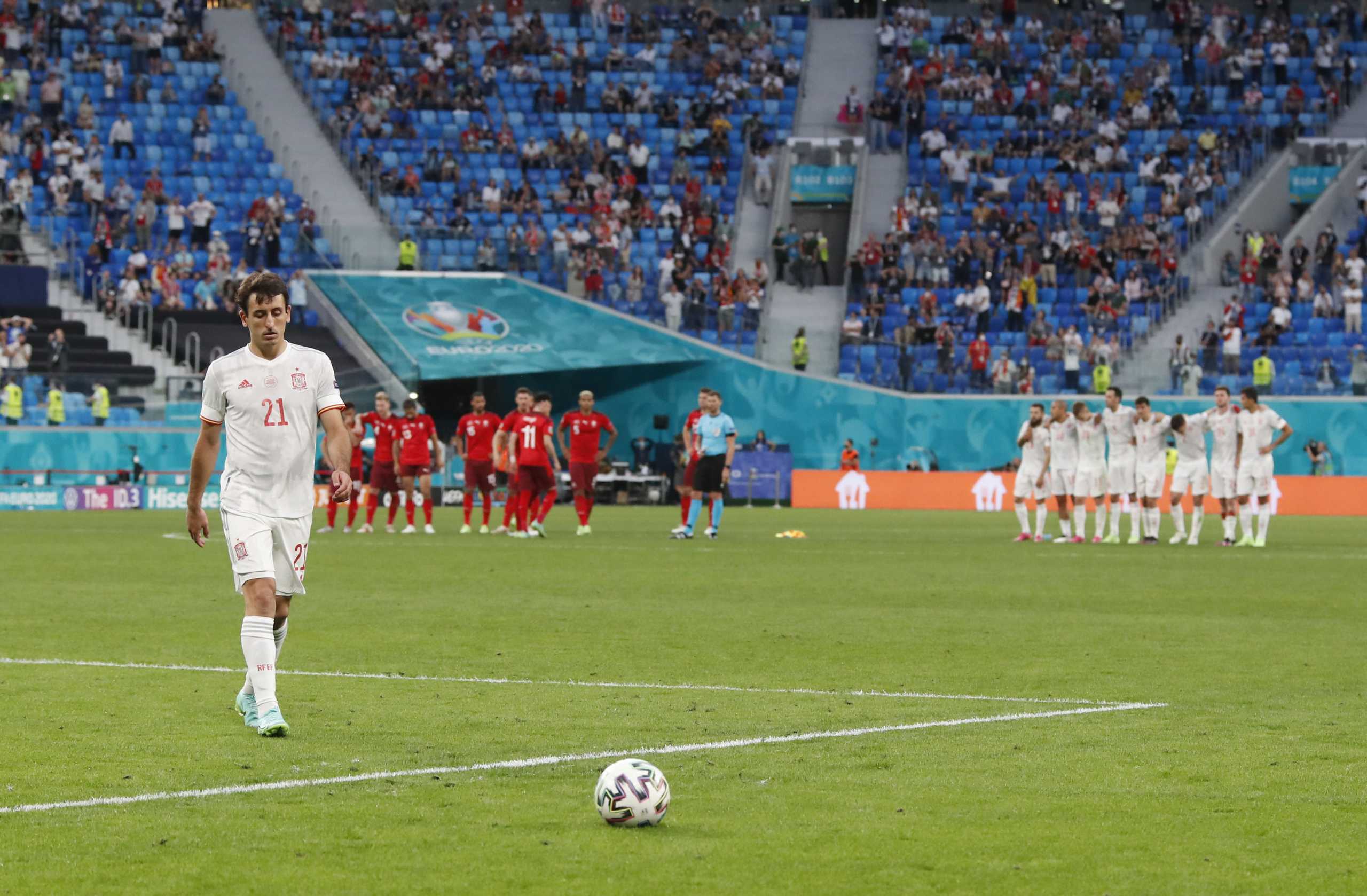 Soccer Football - Euro 2020 - Quarter Final - Switzerland v Spain - Saint Petersburg Stadium, Saint Petersburg, Russia - July 2, 2021  Spain's Mikel Oyarzabal retrieves the ball before scoring the winning penalty in the penalty shootout Pool via REUTERS
