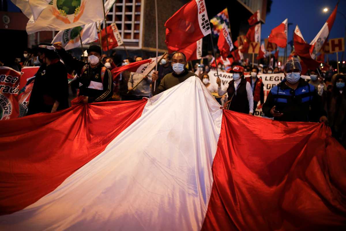 Supporters of Presidential candidate Pedro Castillo protest against the uncertainty, over the result of the presidential elections held a month ago, in Lima, Peru, July 6, 2021. REUTERS