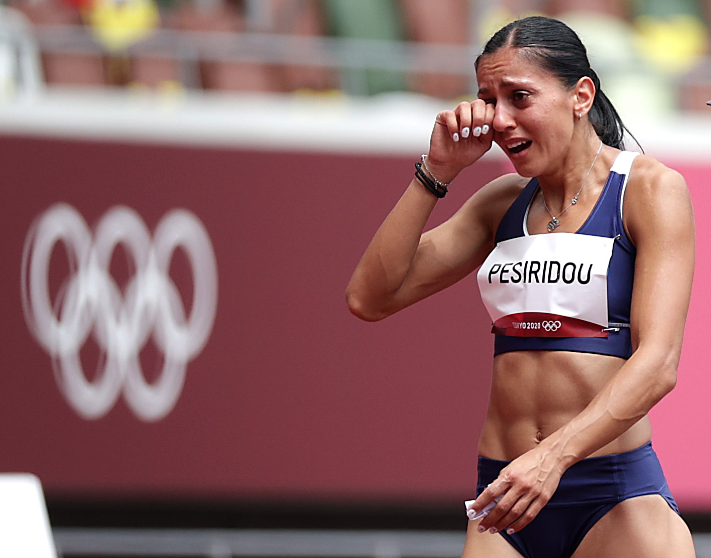 Tokyo 2020 Olympics - Athletics - Women's 100m Hurdles - Round 1 - OLS - Olympic Stadium, Tokyo, Japan - July 31, 2021.  Elisavet Pesiridou of Greece reacts during Heat 3 REUTERS