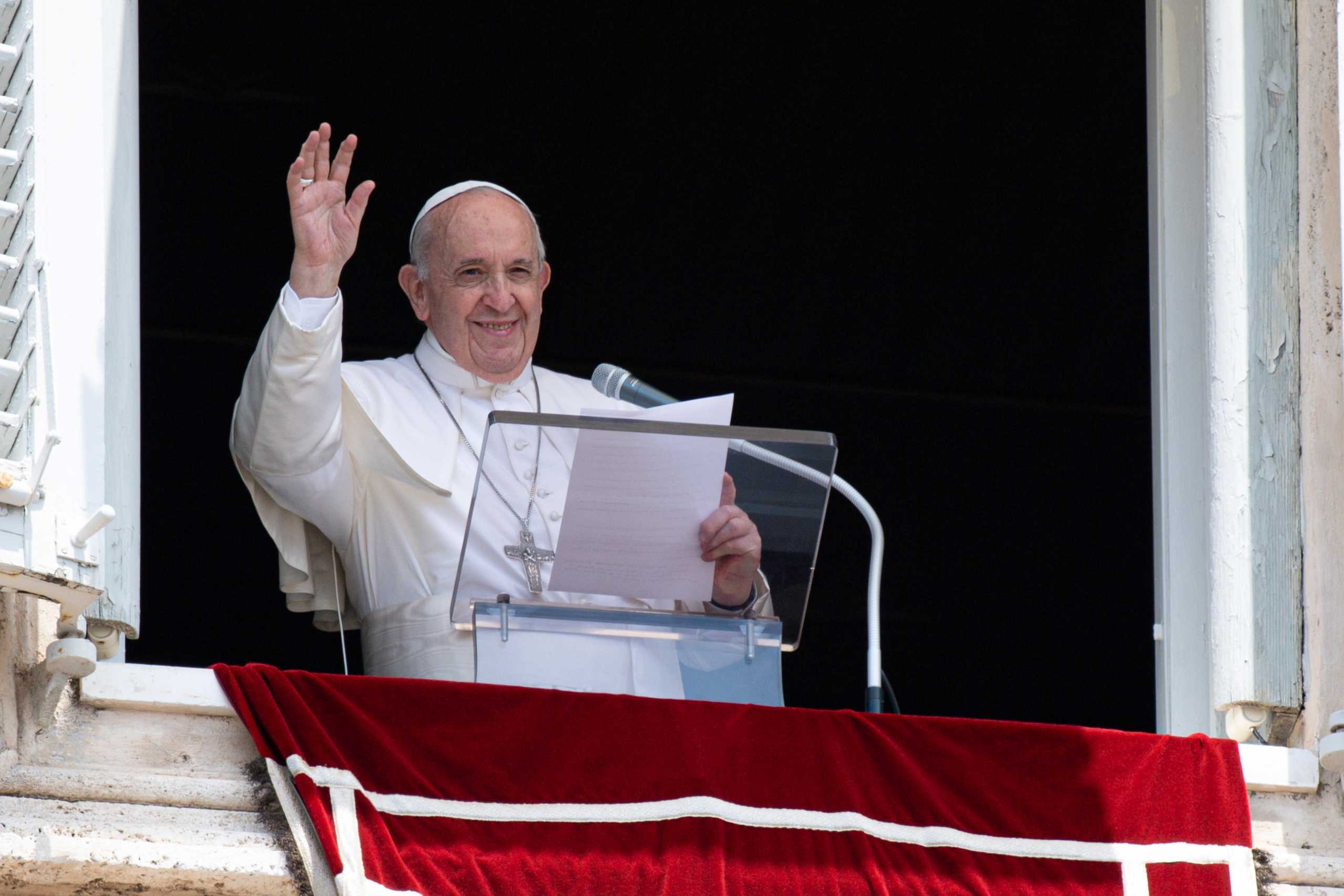 Pope Francis raises his hand in greeting as he delivers the Angelus hours before being admitted to Gemelli hospital for colon surgery, at the Vatican, July 4, 2021. Picture taken July 4, 2021. Vatican Media