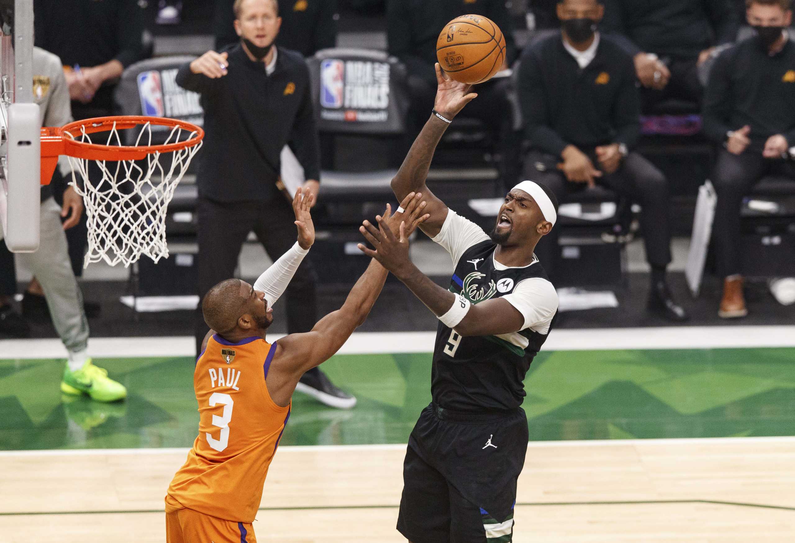 Jul 20, 2021; Milwaukee, Wisconsin, USA; Milwaukee Bucks forward Bobby Portis (9) shoots over Phoenix Suns guard Chris Paul (3) during the second quarter during game six of the 2021 NBA Finals at Fiserv Forum. Mandatory Credit: Jeff Hanisch-USA TODAY Sports