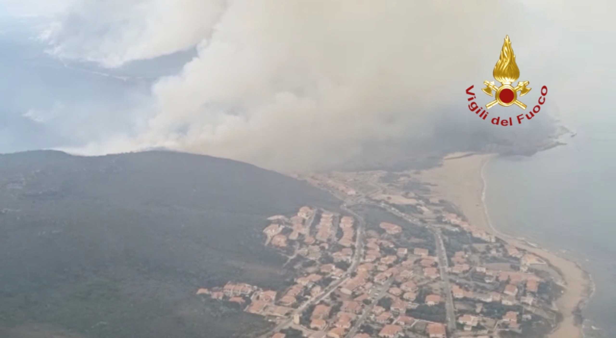 A screen grab taken from a video shows a large wildfire that broke out near Oristano, Sardinia, Italy July 25, 2021. Picture taken July 25, 2021. Vigili del Fuoco