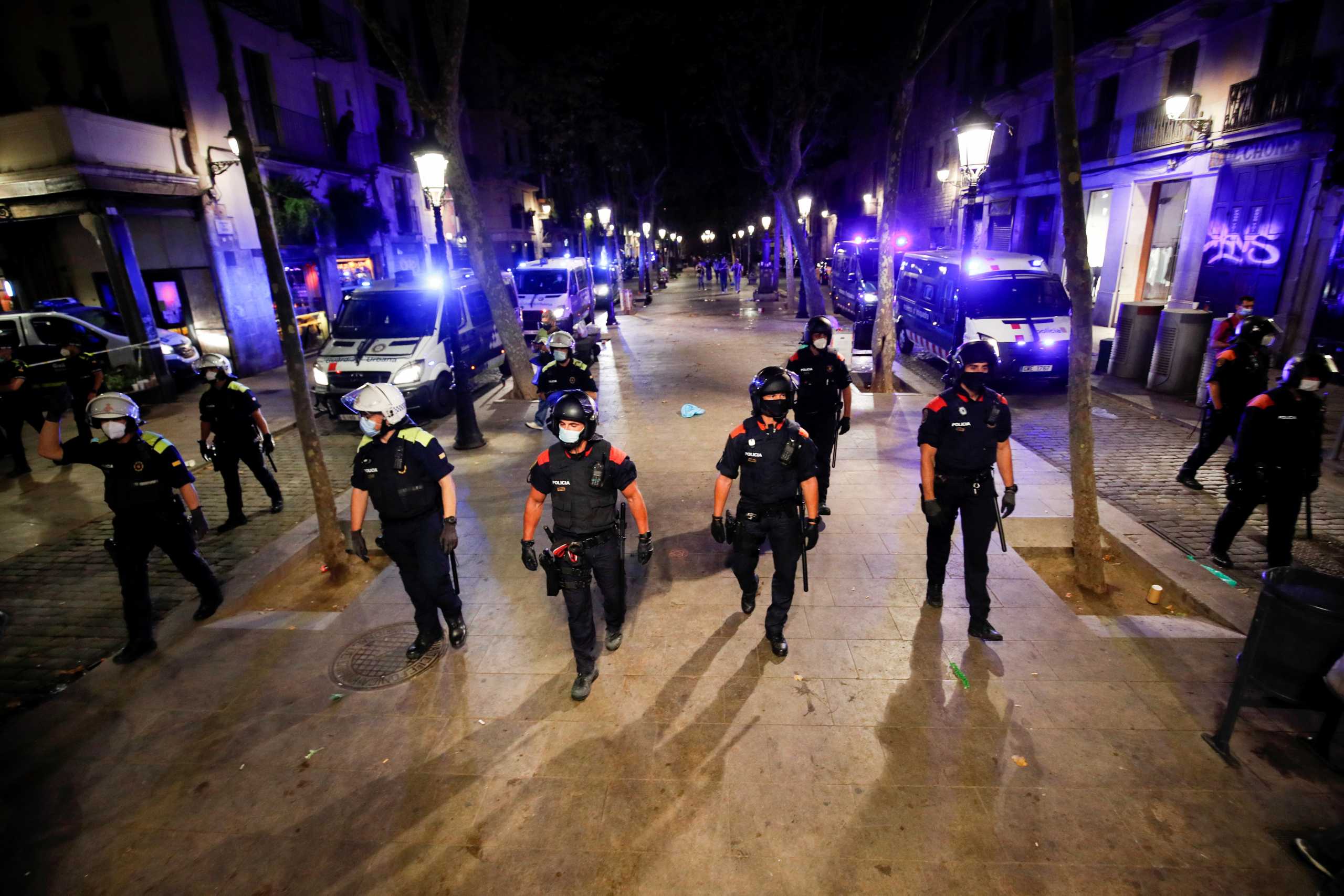 Police arrive to remove people gathering at Born neighborhood, as the regional government decreed a night curfew (from 1am to 6am) to prevent the spread of the coronavirus (COVID-19) in Barcelona, Spain, May 17, 2021. REUTERS