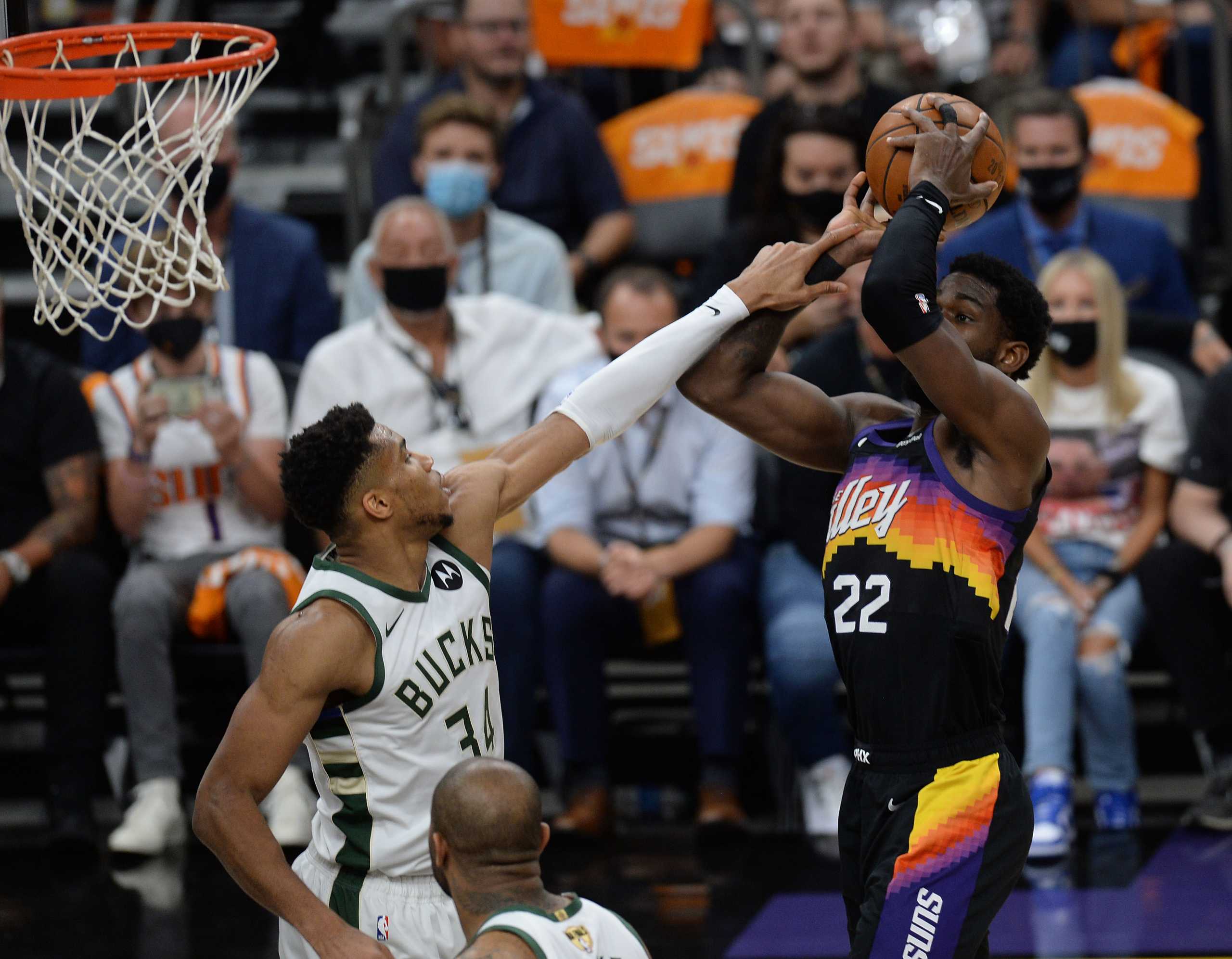 Jul 6, 2021; Phoenix, Arizona, USA; Phoenix Suns center Deandre Ayton (22) shoots against Milwaukee Bucks forward Giannis Antetokounmpo (34) during the first half in game one of the 2021 NBA Finals at Phoenix Suns Arena. Mandatory Credit: Joe Camporeale-USA TODAY Sports