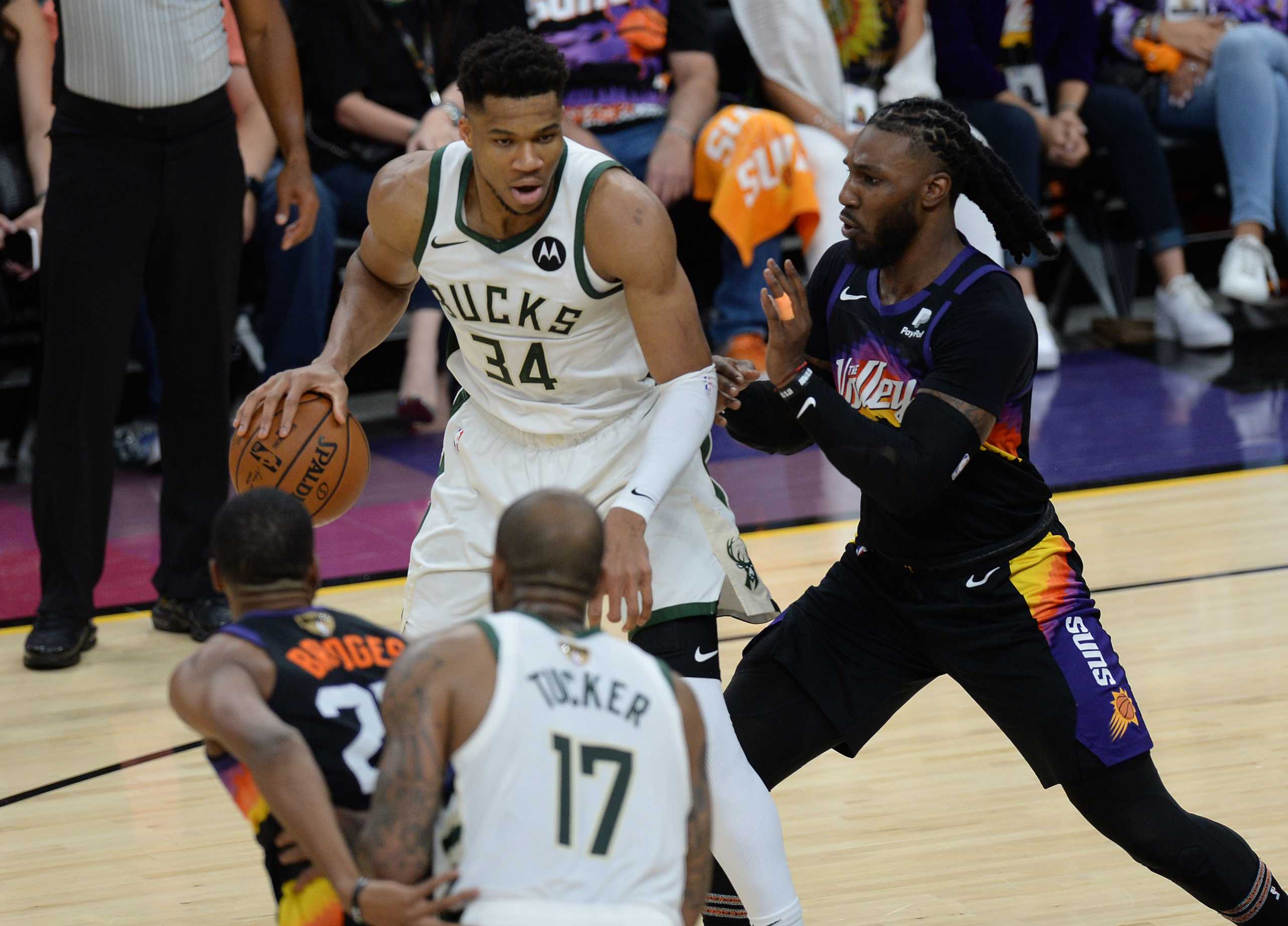 Jul 6, 2021; Phoenix, Arizona, USA; Milwaukee Bucks forward Giannis Antetokounmpo (34) moves the ball against Phoenix Suns forward Jae Crowder (99) during the first half in game one of the 2021 NBA Finals at Phoenix Suns Arena. Mandatory Credit: Joe Camporeale-USA TODAY Sports