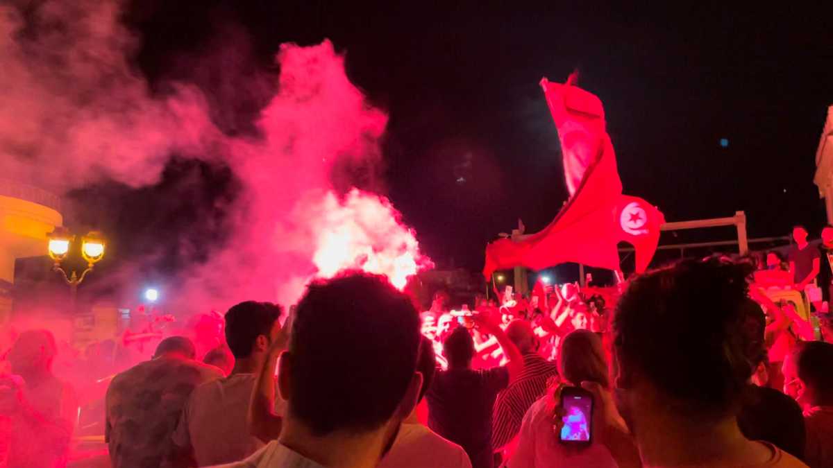 People react in the street after Tunisia's president dismissed the government and froze parliament, in La Marsa, Tunisia, July 26, 2021 in this still image obtained from a social media video. Layli Foroudi