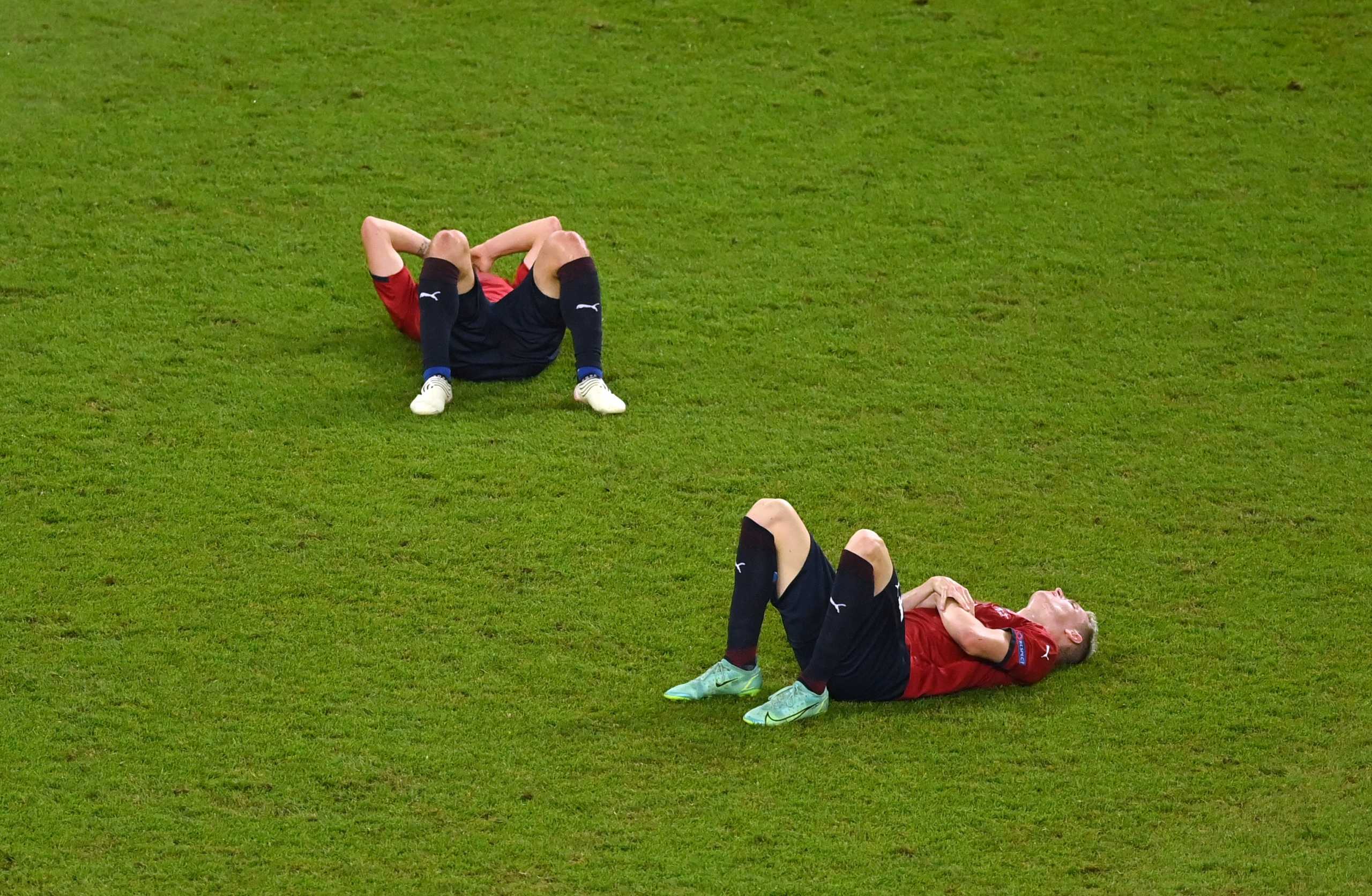 Soccer Football - Euro 2020 - Quarter Final - Czech Republic v Denmark - Baku Olympic Stadium, Baku, Azerbaijan - July 3, 2021 Czech Republic's Matej Vydra and Jan Boril look dejected after the match Pool via REUTERS