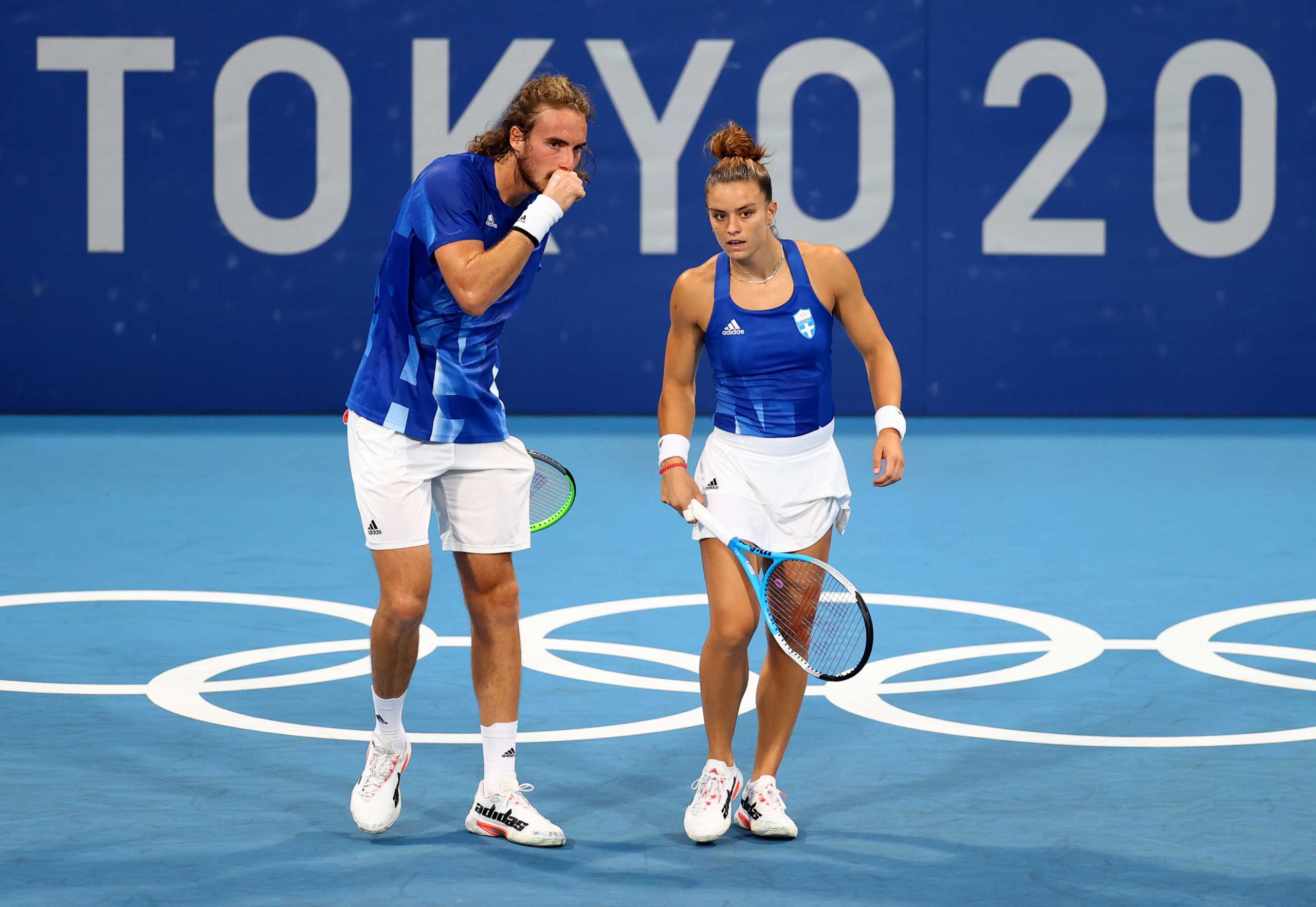 Tokyo 2020 Olympics - Tennis - Mixed Doubles - Round 1 - Ariake Tennis Park - Tokyo, Japan - July 28, 2021. Maria Sakkari of Greece and Stefanos Tsitsipas of Greece react during their first round match against Felix Auger-Aliassime of Canada and Gabriela Dabrowski of Canada REUTERS