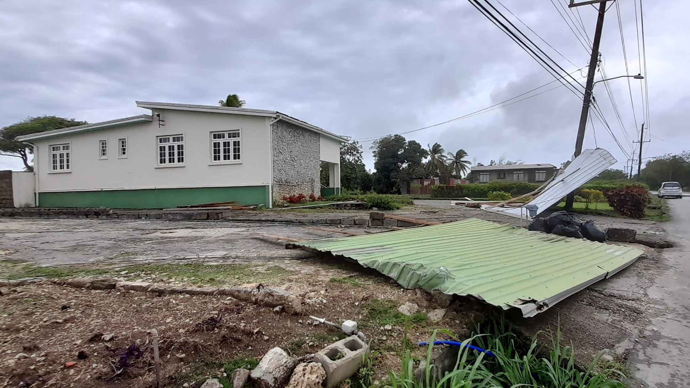 A roof lies near a road after strong winds of Hurricane Elsa passed St. Michael, Barbados July 2, 2021.  REUTERS