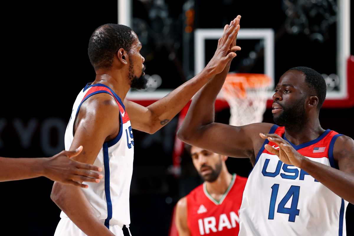 Tokyo 2020 Olympics - Basketball - Men - Group A - United States v Iran - Saitama Super Arena, Saitama, Japan - July 28, 2021. Kevin Durant of the United States celebrates scoring a three pointer with Draymond Green of the United States REUTERS