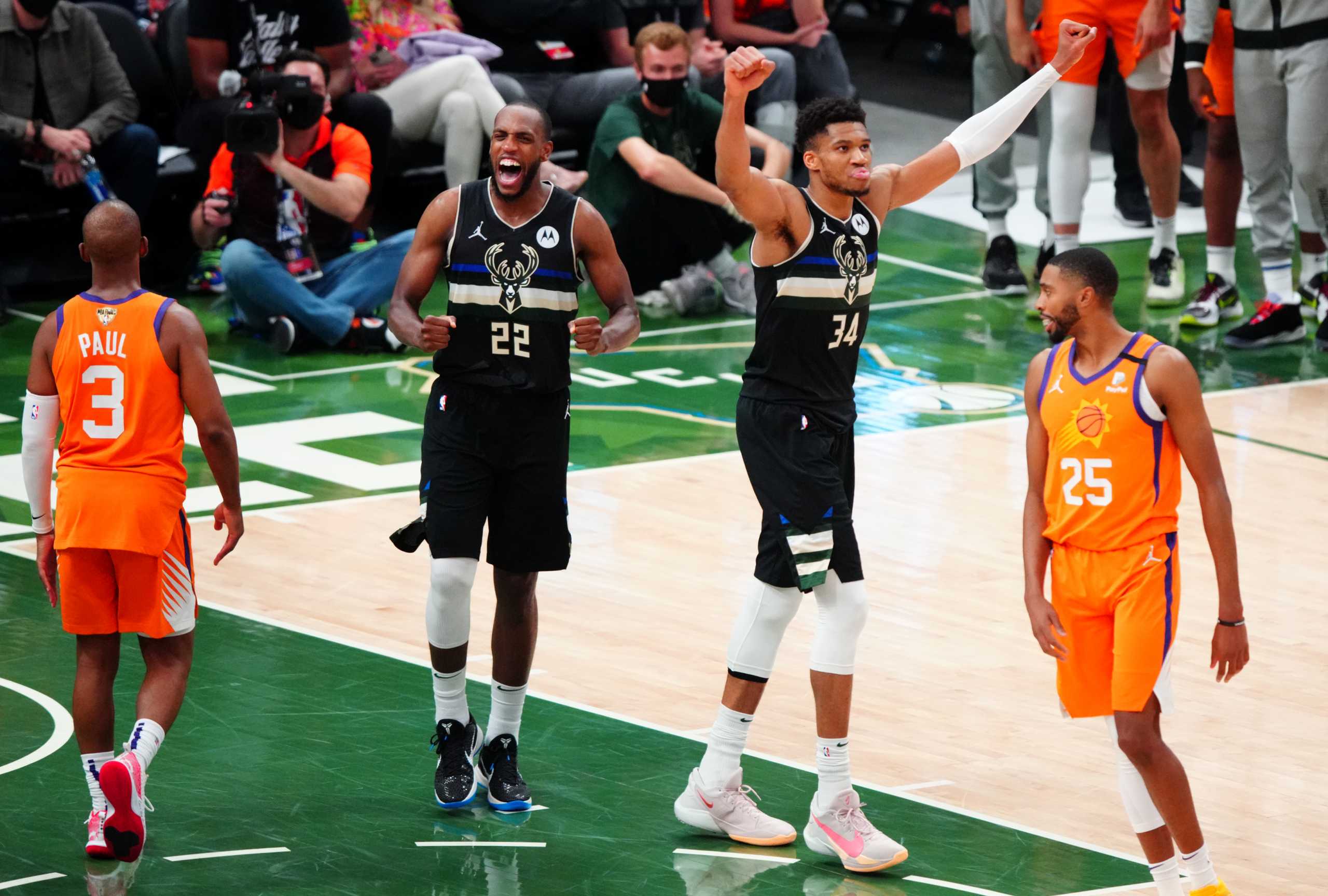Jul 20, 2021; Milwaukee, Wisconsin, USA;  Milwaukee Bucks forward Giannis Antetokounmpo (34) and Milwaukee Bucks forward Khris Middleton (22) celebrate after winning game six of the 2021 NBA Finals and the championship against the Phoenix Suns at Fiserv Forum. Mandatory Credit: Mark J. Rebilas-USA TODAY Sports