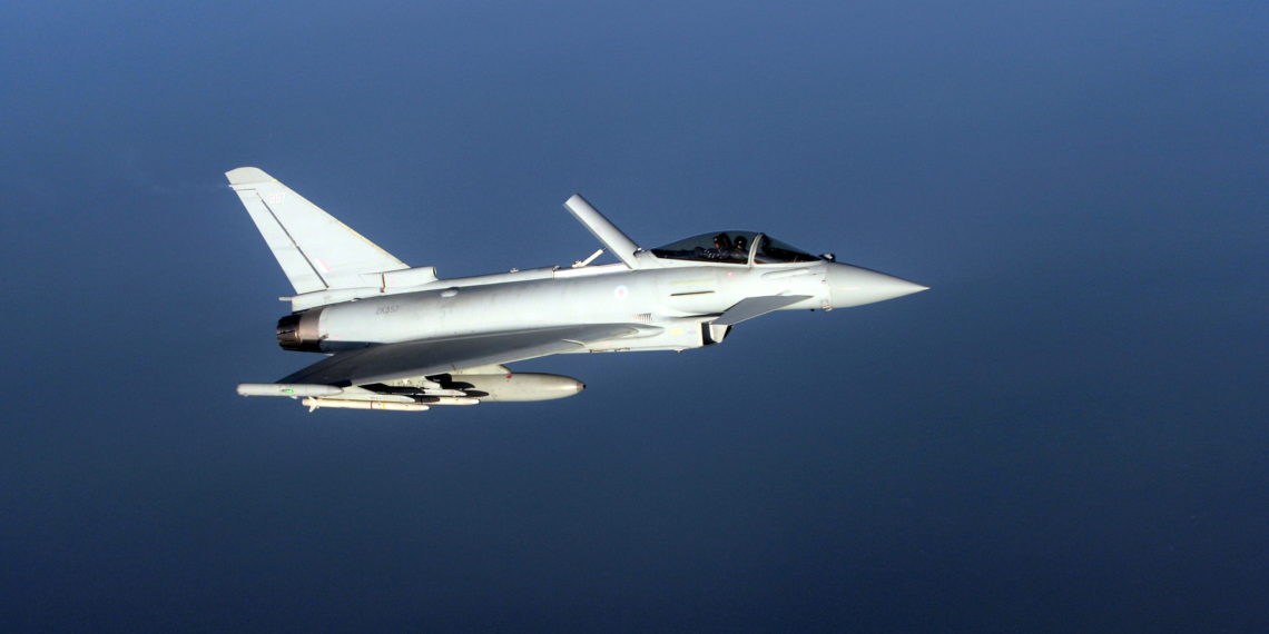 FILE PHOTO: A British Royal Air Force's Eurofighter Typhoon jet demonstrates the interception of a Belgian air force transport plane as they fly over Britain, January 14, 2020 as part of NATO drills to deter Russian planes from entering allied airspace. Both Ultra Electronics and Cobham have technologies used in the Eurofighter Typhoon jet. REUTERS