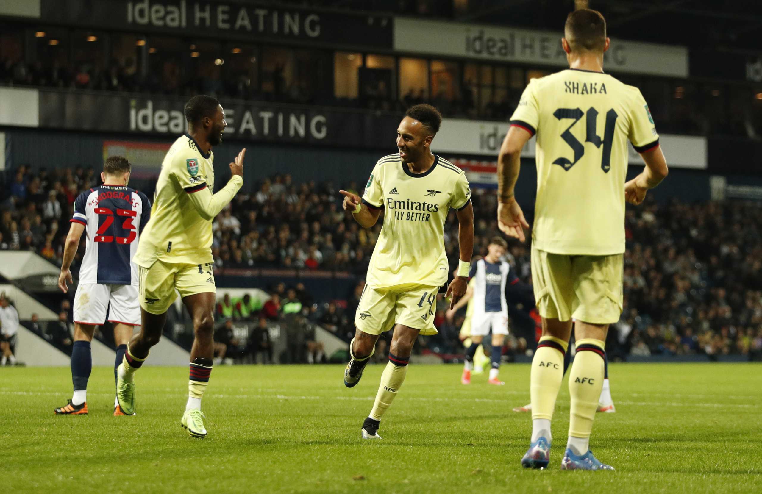 Soccer Football - Carabao Cup - Second Round - West Bromwich Albion v Arsenal - The Hawthorns, West Bromwich, Britain - August 25, 2021 Arsenal's Pierre-Emerick Aubameyang celebrates scoring their fifth goal and his hat-trick with Ainsley Maitland-Niles Action Images via Reuters