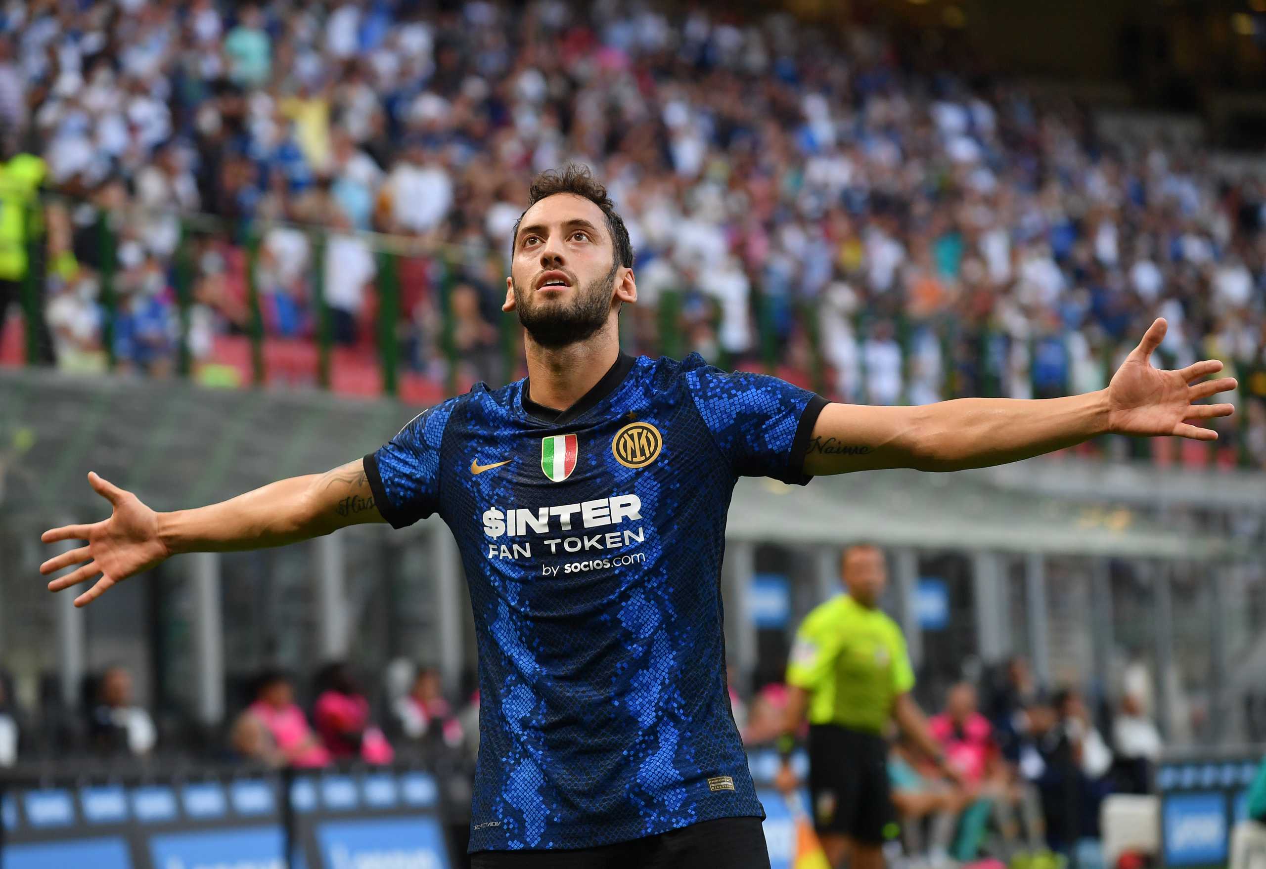 Soccer Football - Italy - Serie A - Inter Milan v Genoa - San Siro, Milan, Italy - August 21, 2021 Inter Milan's Hakan Calhanoglu celebrates scoring their second goal REUTERS