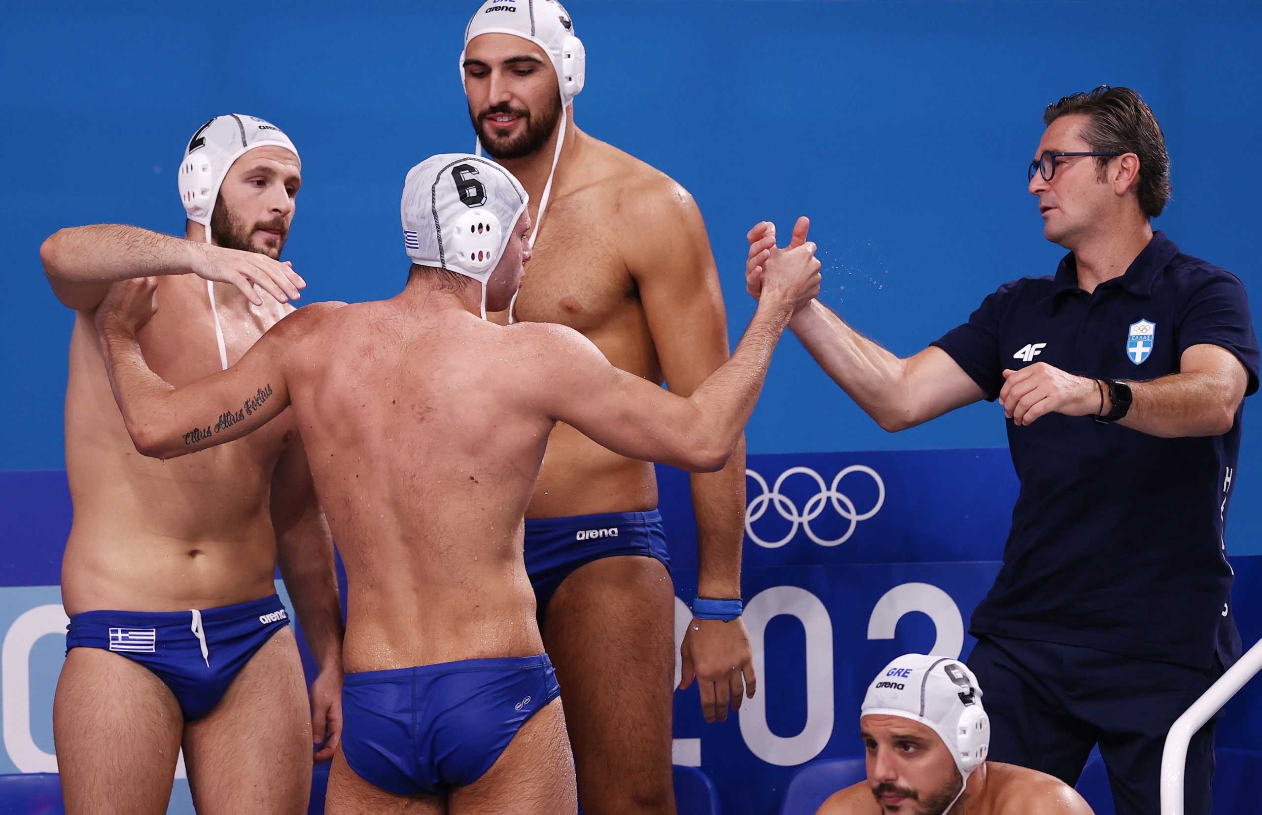 Tokyo 2020 Olympics - Water Polo - Men - Quarterfinal - Greece v Montenegro - TWC - Tatsumi Water Polo Centre, Tokyo, Japan - August 4, 2021. Alexandros Papanastasiou of Greece celebrates with team members. REUTERS