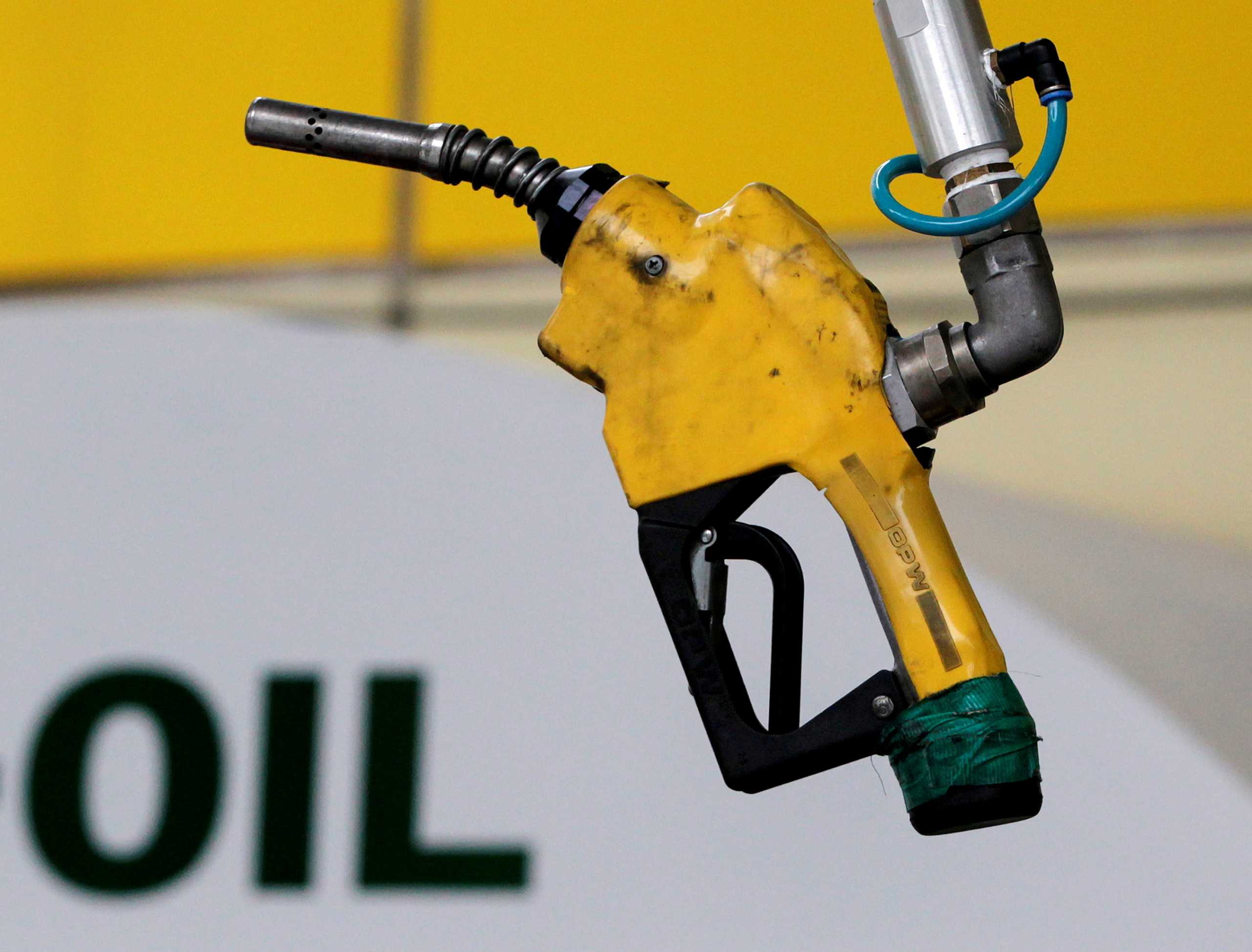 FILE PHOTO: A gas pump at a petrol station in Seoul June 27, 2011. REUTERS