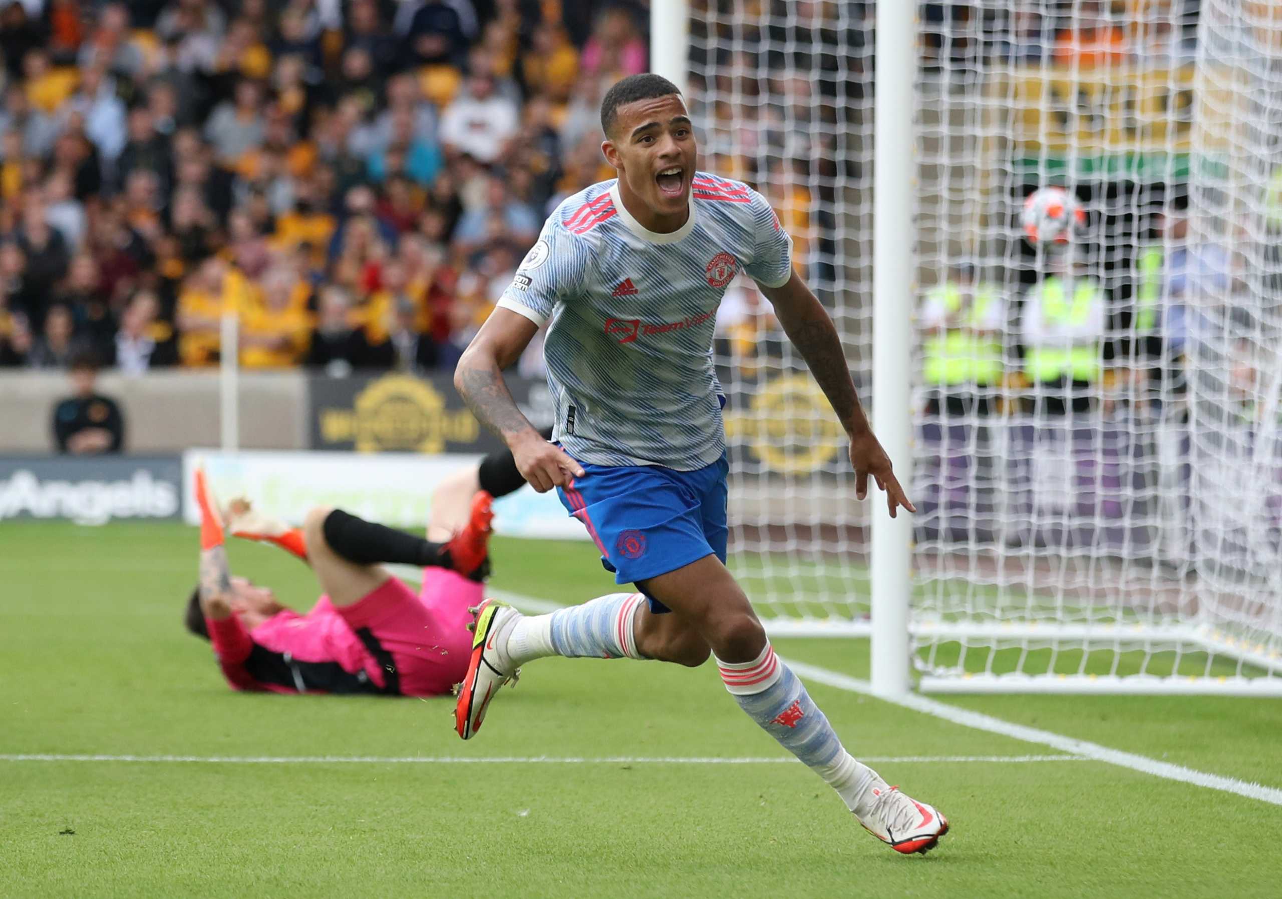Soccer Football - Premier League - Wolverhampton Wanderers v Manchester United - Molineux Stadium, Wolverhampton, Britain - August 29, 2021 Manchester United's Mason Greenwood celebrates scoring their first goal Action Images via Reuters
