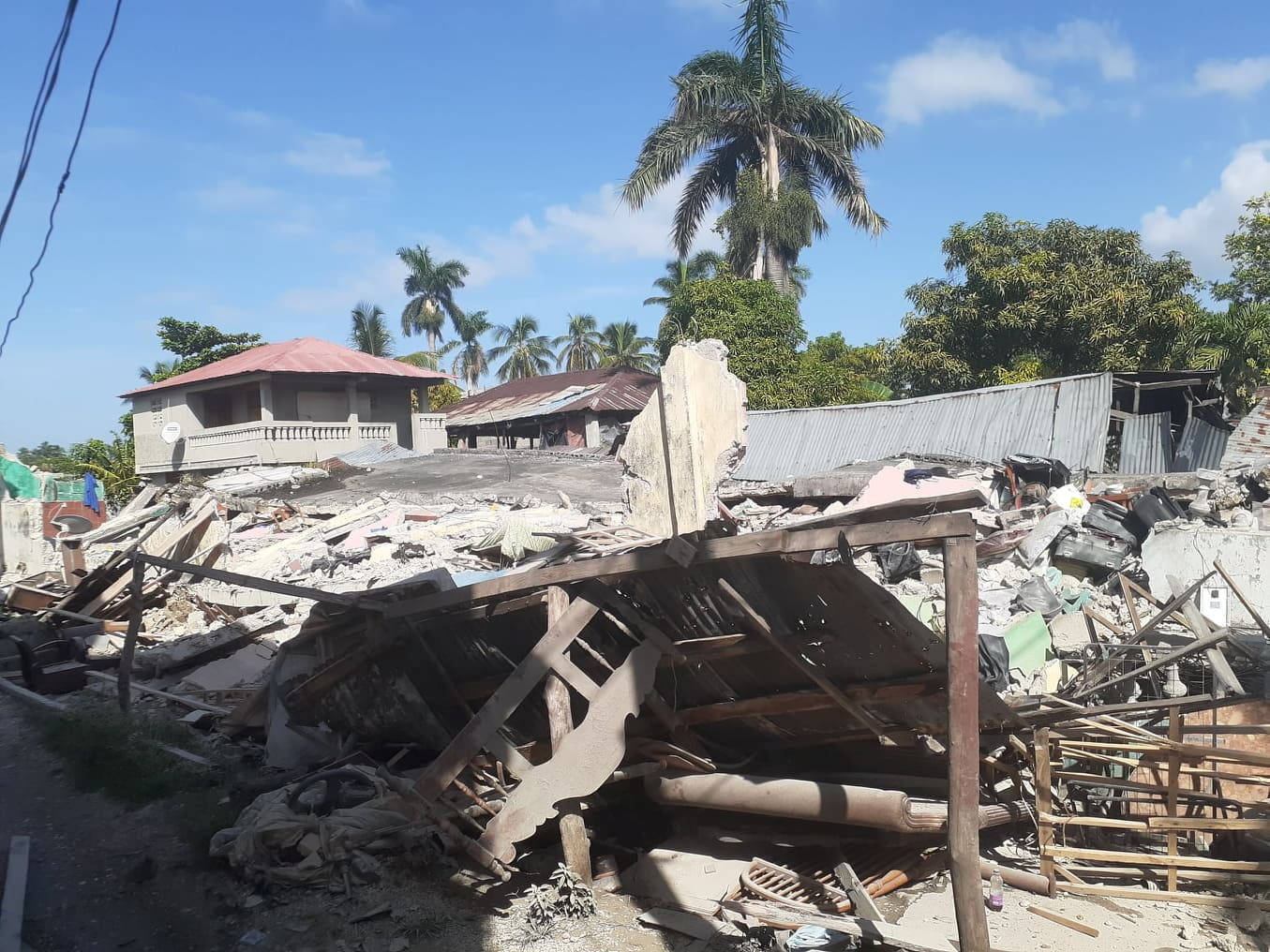 Damage is seen in an area after a major earthquake struck southwestern Haiti, in Les Cayes, Haiti August 14, 2021. Courtesy of  Jose Flecher
