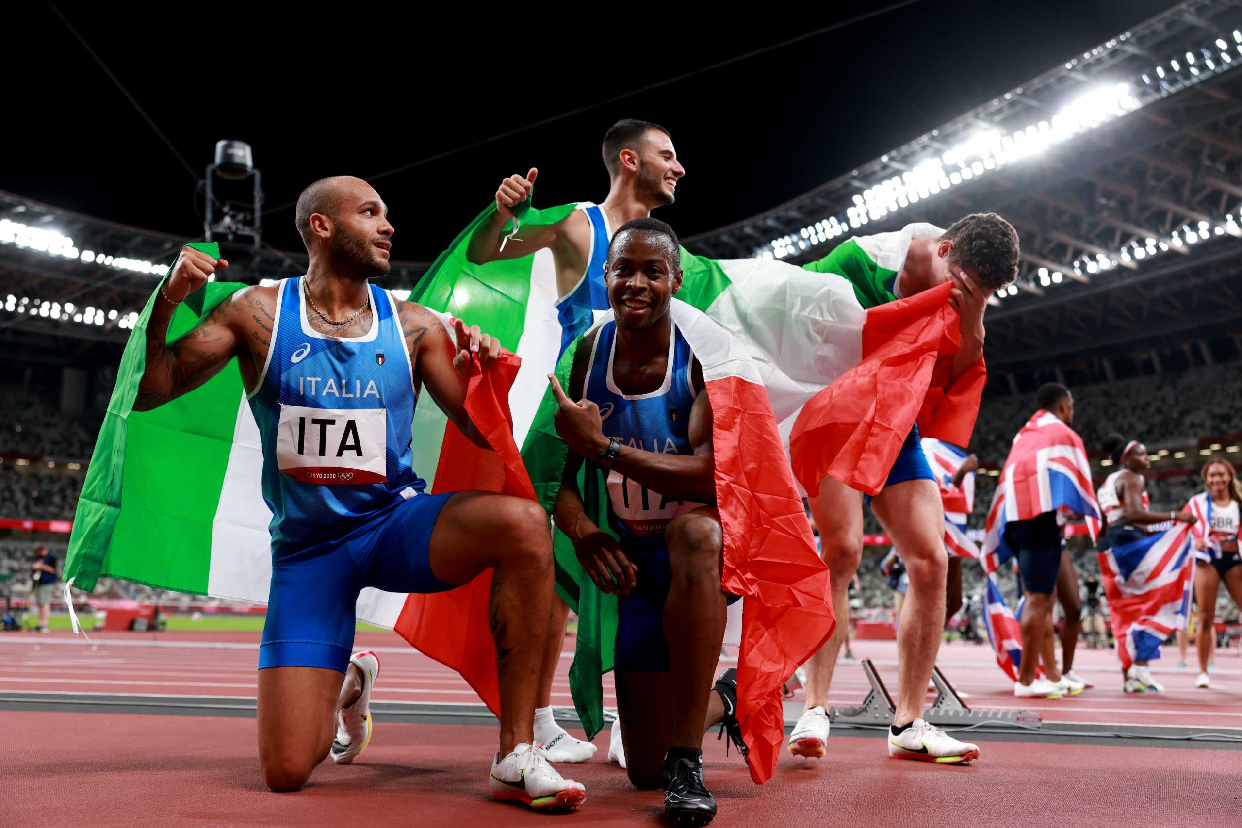 Tokyo 2020 Olympics - Athletics - Men's 4 x 100m Relay - Final - Olympic Stadium, Tokyo, Japan - August 6, 2021. Lorenzo Patta of Italy, Filippo Tortu of Italy, Lamont Marcell Jacobs of Italy and Eseosa Desalu of Italy celebrate after winning gold REUTERS