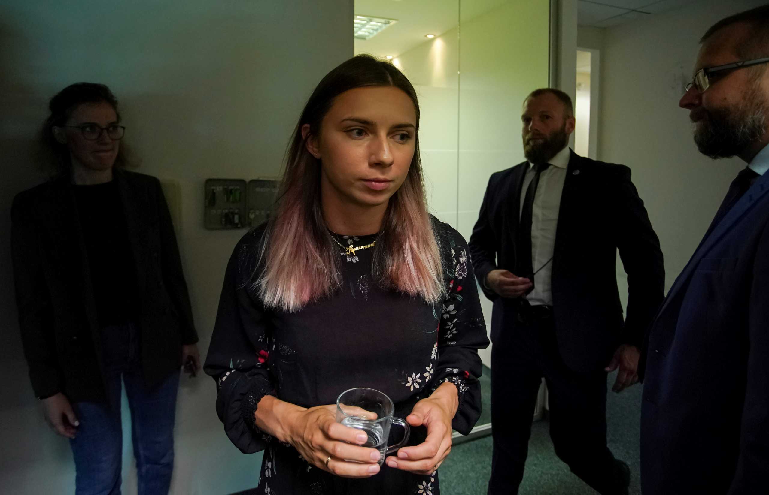 FILE PHOTO: Belarusian sprinter Krystsina Tsimanouskaya, who left the Olympic Games in Tokyo and seeks asylum in Poland, walks to attend an interview with Reuters in Warsaw, Poland August 5, 2021. REUTERS