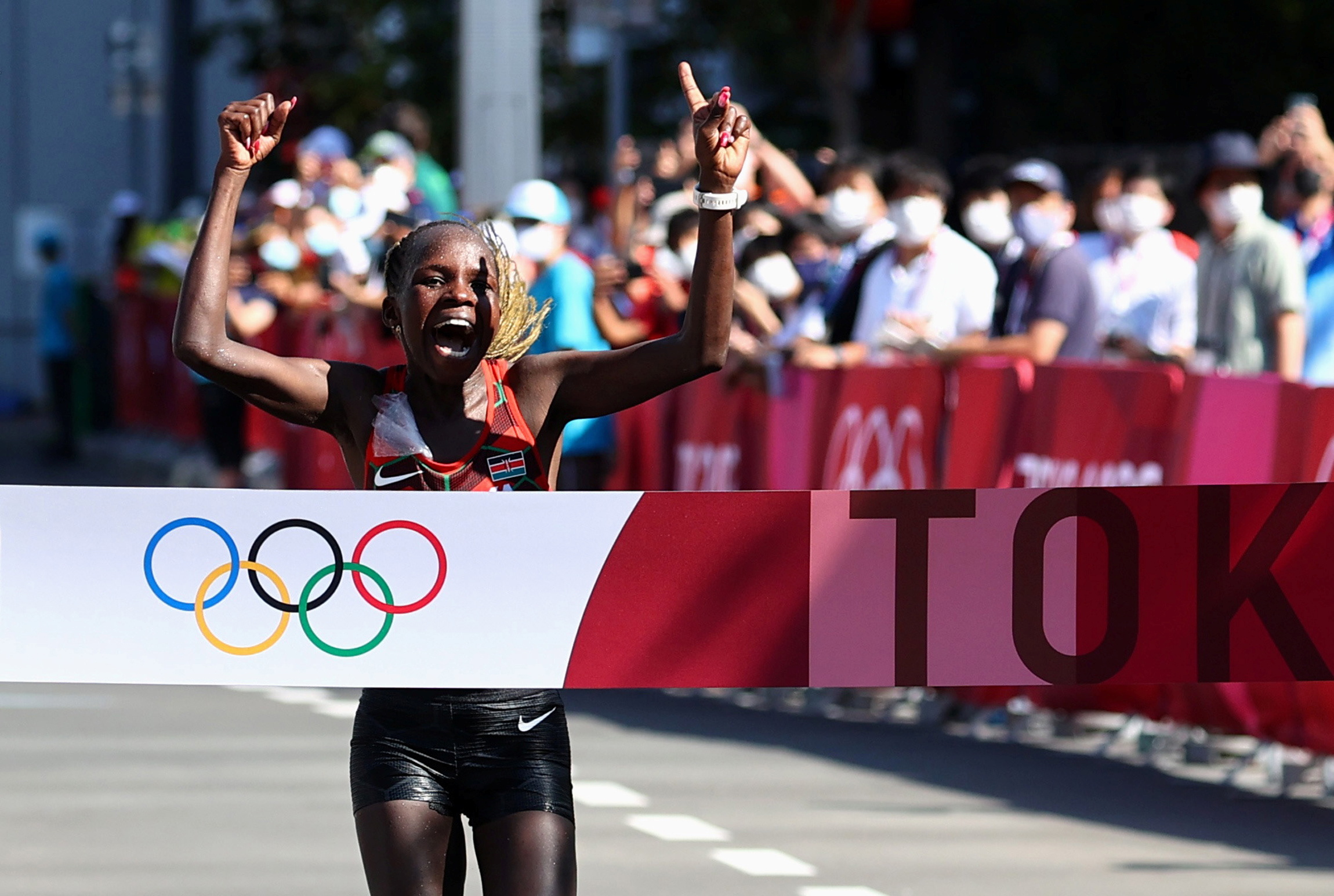 Tokyo 2020 Olympics - Athletics - Women's Marathon - Sapporo Odori Park, Sapporo, Japan - August 7, 2021. Peres Jepchirchir of Kenya celebrates as she wins gold REUTERS