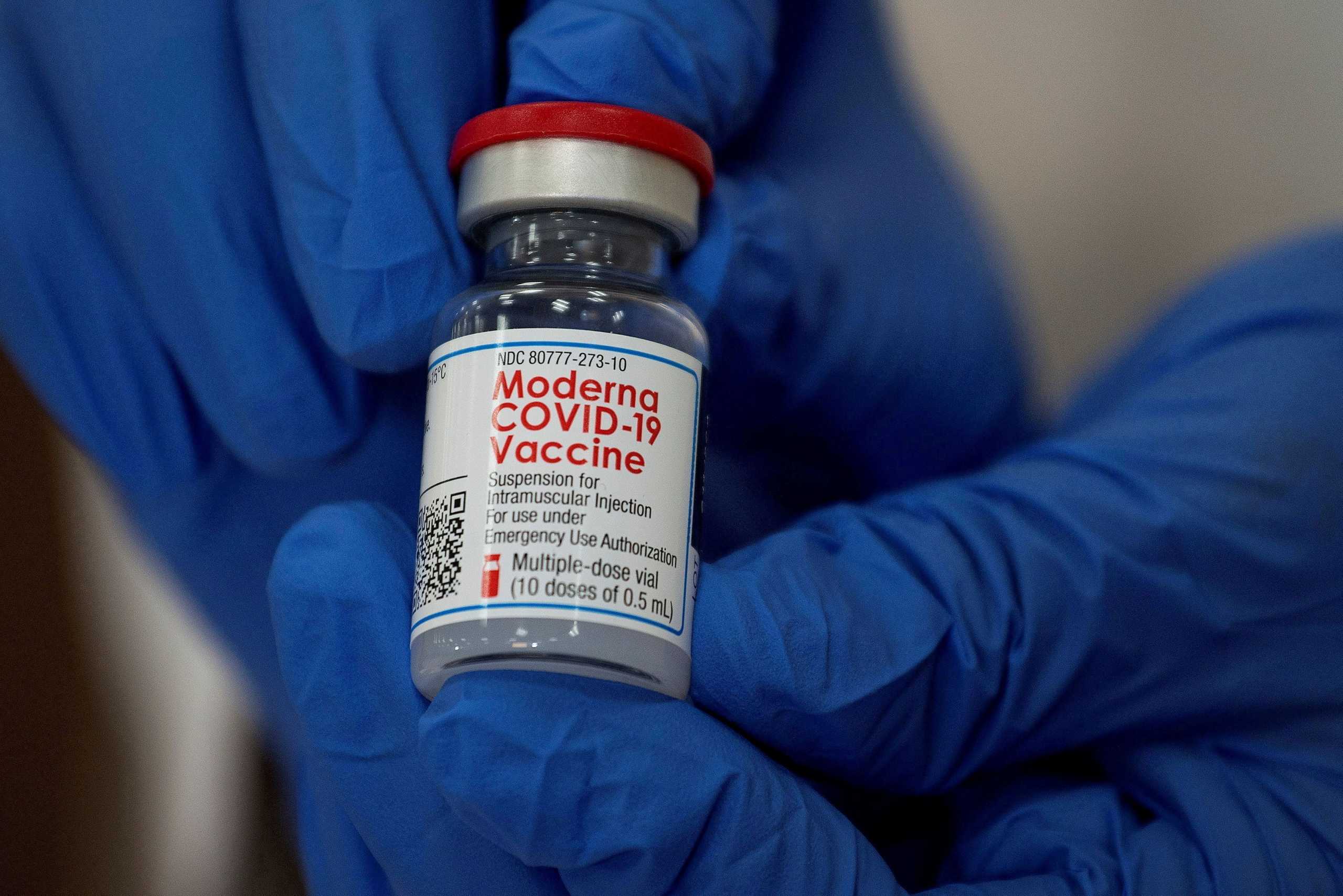 FILE PHOTO: FILE PHOTO: An employee shows the Moderna COVID-19 vaccine at Northwell Health's Long Island Jewish Valley Stream hospital in New York, U.S., December 21, 2020.   REUTERS