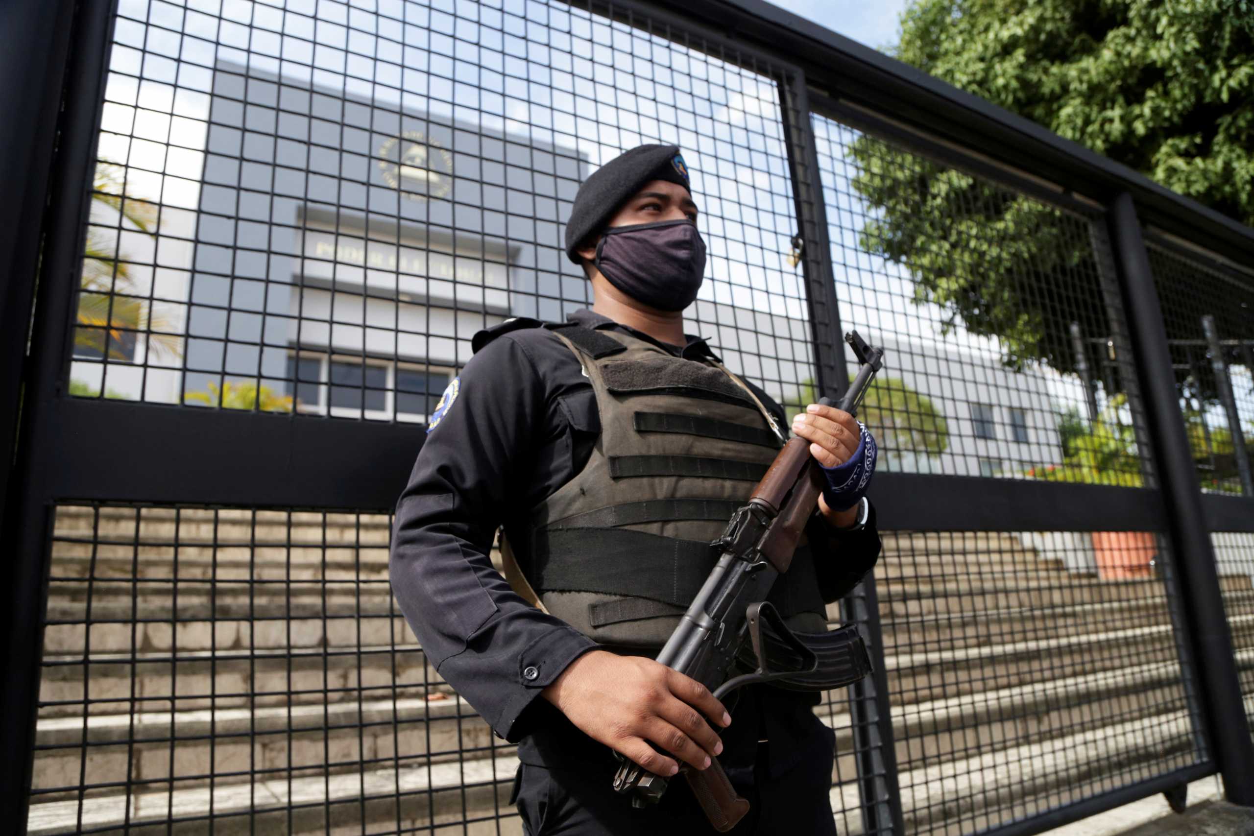 A Nicaraguan police officer keeps watch outside the Supreme Electoral Council (CSE) as the political parties register their presidential candidates for the November 7 general election, in Managua, Nicaragua August 2, 2021. REUTERS