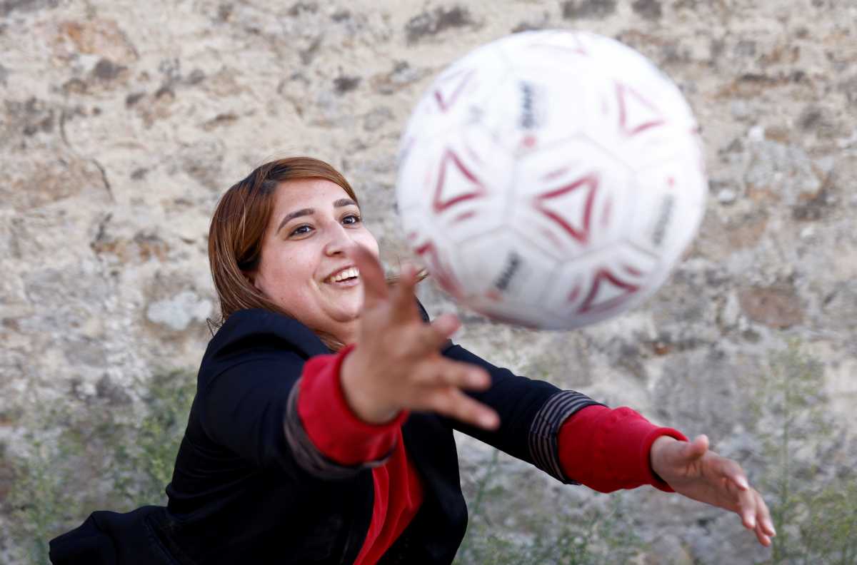 Afghan refugee Fanoos Basir, 25, a former player in the Afghanistan women's national soccer team, poses in front of the Razay reception centre in Piriac-sur-Mer following their evacuation from Afghanistan last week, France, August 30, 2021. Picture taken August 30, 2021. REUTERS