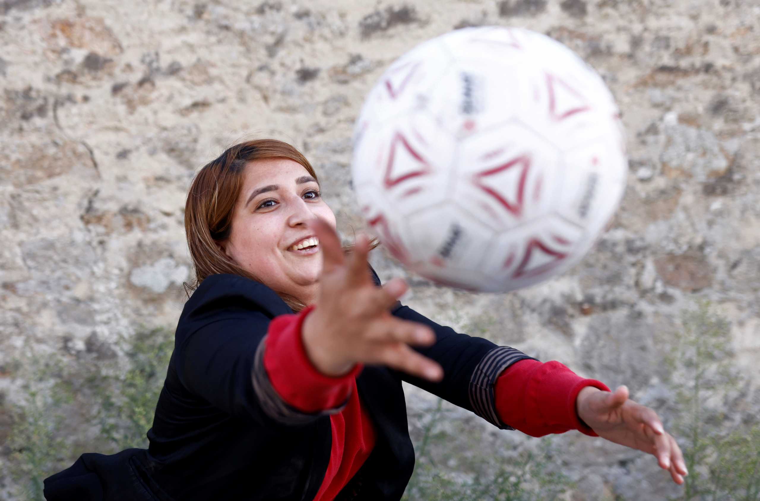 Afghan refugee Fanoos Basir, 25, a former player in the Afghanistan women's national soccer team, poses in front of the Razay reception centre in Piriac-sur-Mer following their evacuation from Afghanistan last week, France, August 30, 2021. Picture taken August 30, 2021. REUTERS