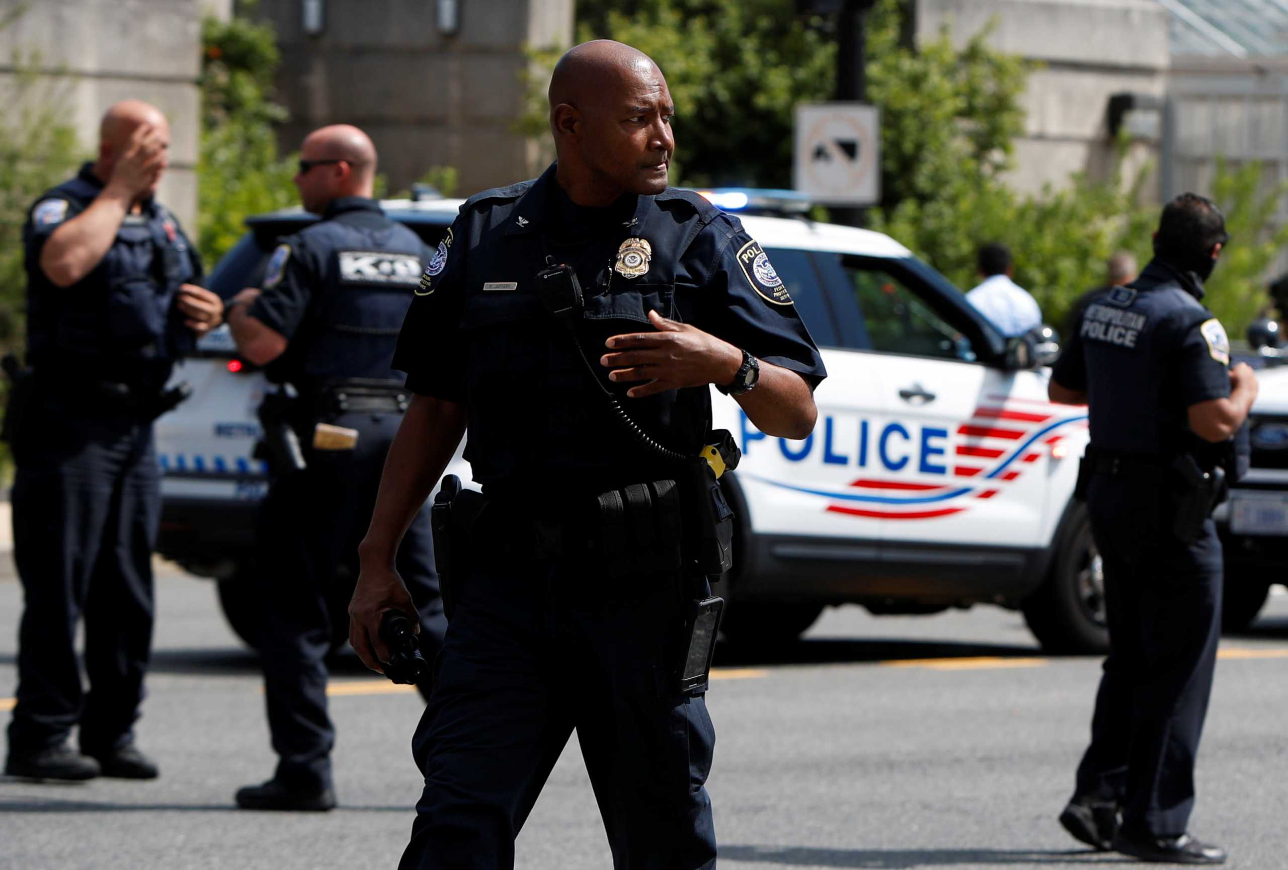 Police officers man a police barricade while responding to a bomb threat near the U.S. Capitol in Washington, U.S., August 19, 2021. REUTERS