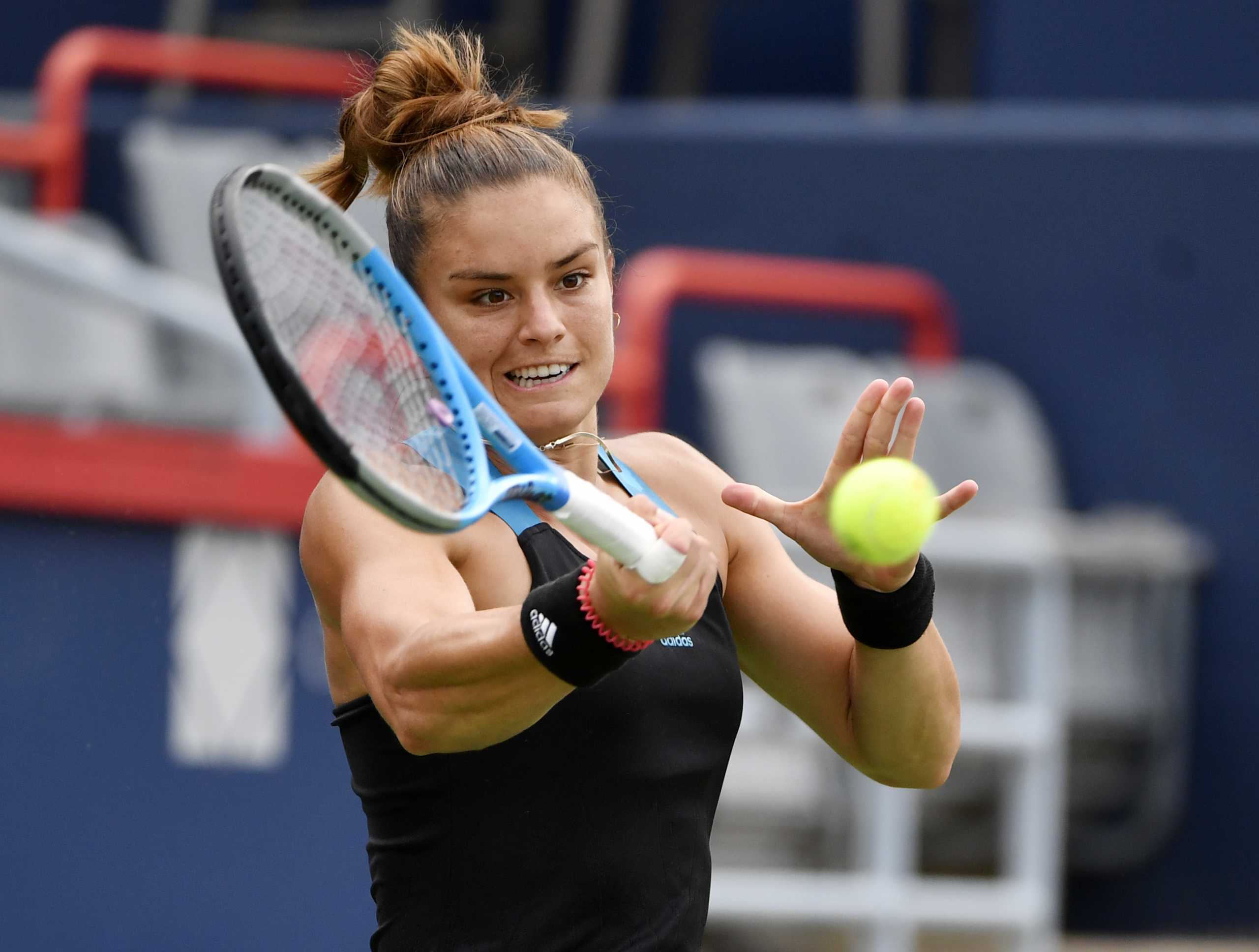 Aug 12, 2021; Montreal, Quebec, Canada; Maria Sakkari of Greece hits a shot against Victoria Azarenka of Belarus (not pictured) during third round play at Stade IGA. Mandatory Credit: Eric Bolte-USA TODAY Sports