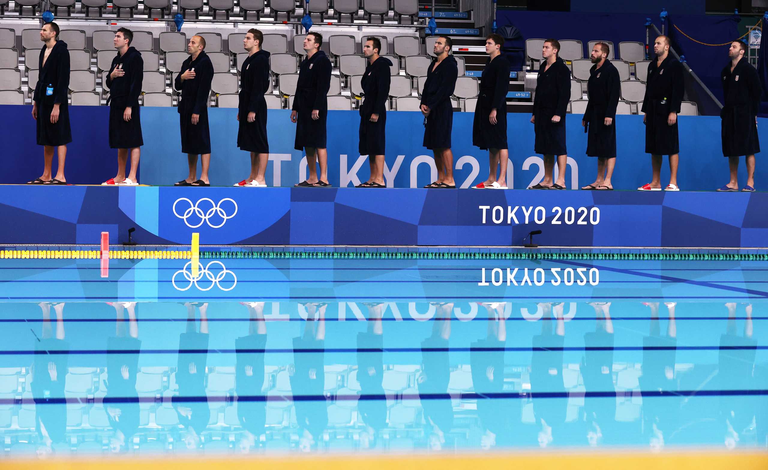 Tokyo 2020 Olympics - Water Polo - Men - Semifinal - Serbia v Spain - TWC - Tatsumi Water Polo Centre, Tokyo, Japan - August 6, 2021. Serbia's team members stand near the pool ahead of the match. REUTERS