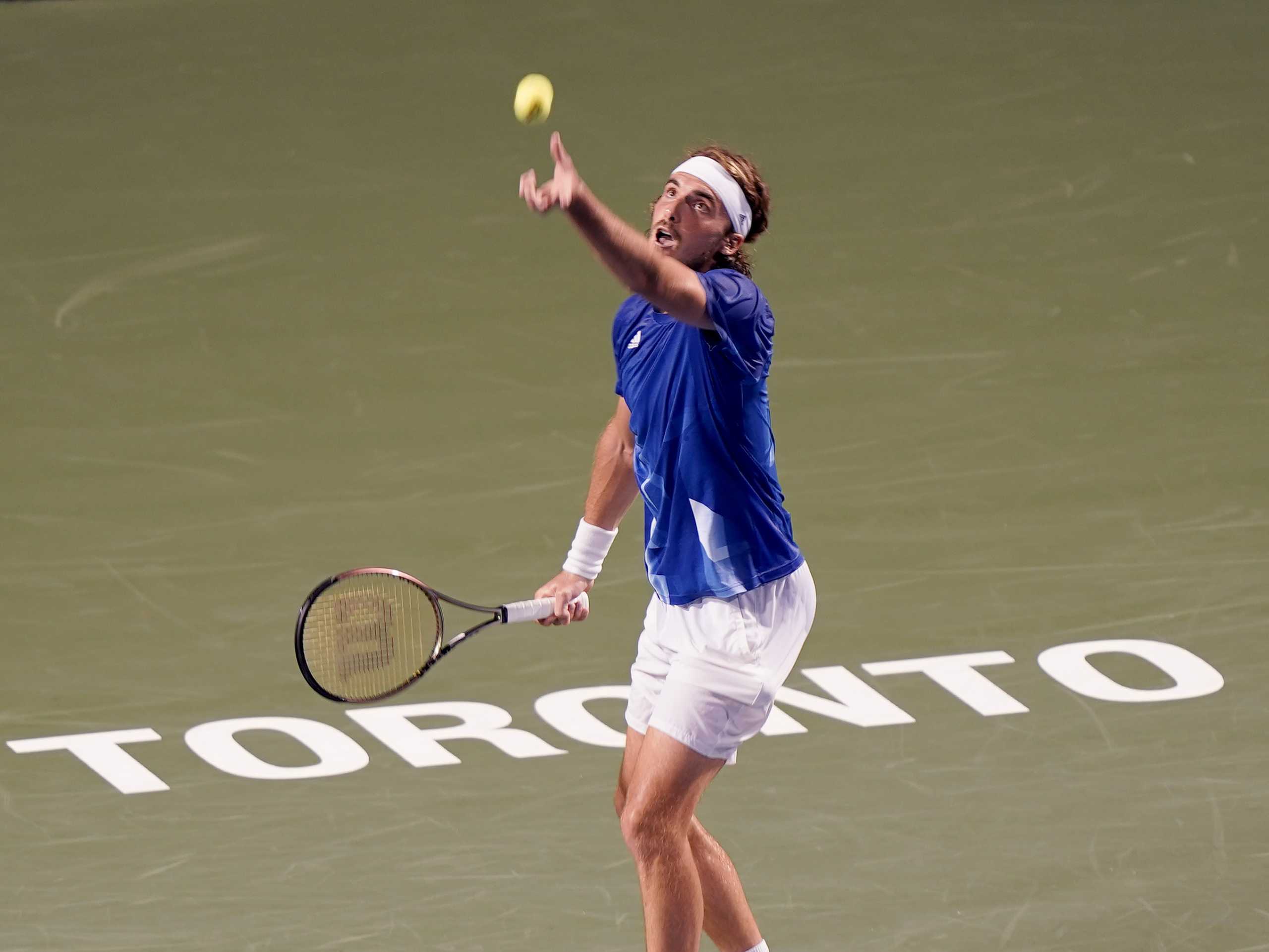 Aug 10, 2021; Toronto, Ontario, Canada; Stefanos Tsitsipas of Greece goes to serve a ball to Ugo Humbert of France (not pictured) at Aviva Centre. Mandatory Credit: John E. Sokolowski-USA TODAY Sports