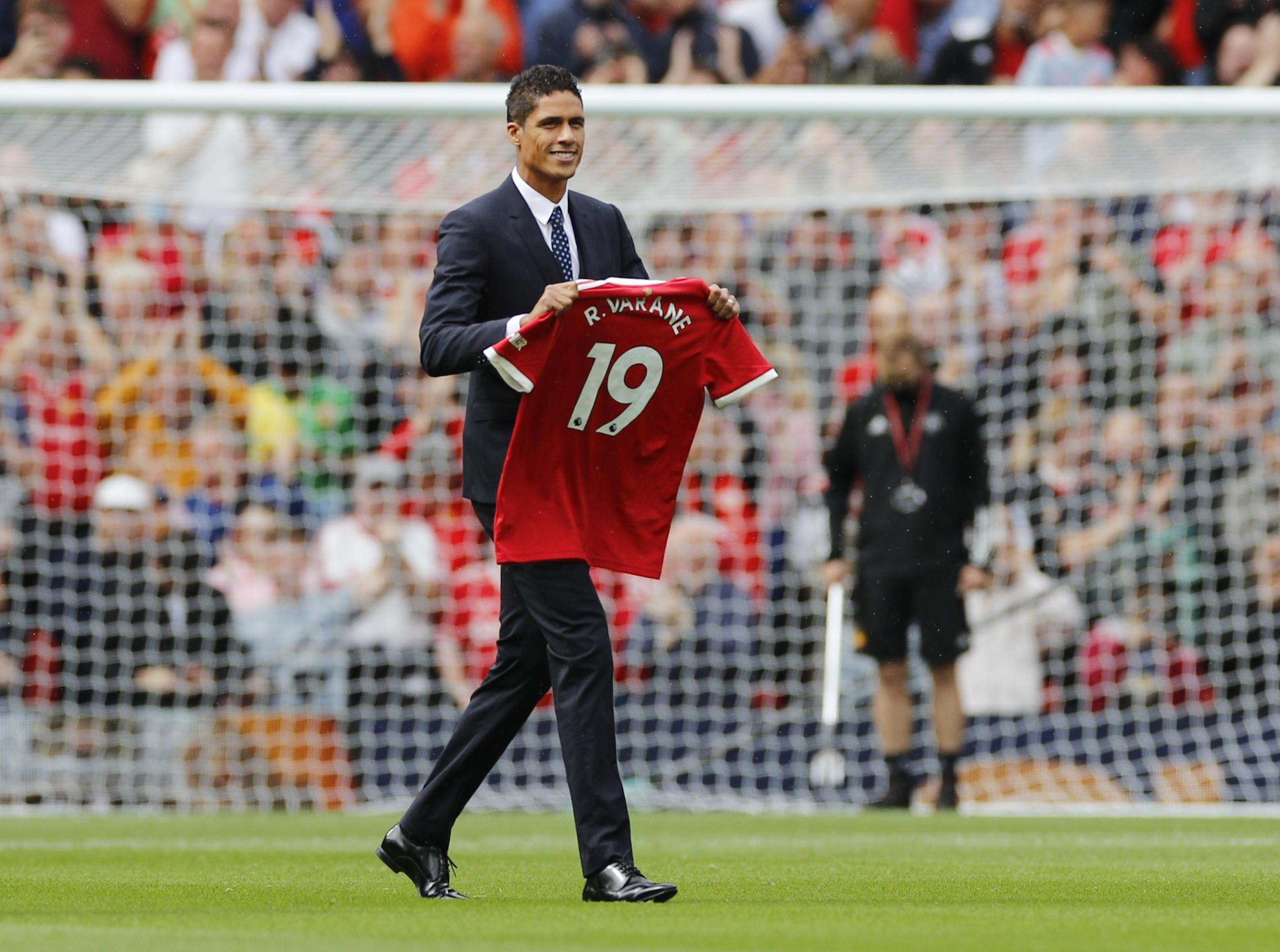 Soccer Football - Premier League - Manchester United v Leeds United - Old Trafford, Manchester, Britain - August 14, 2021 Manchester United's Raphael Varane is presented to fans before the match REUTERS