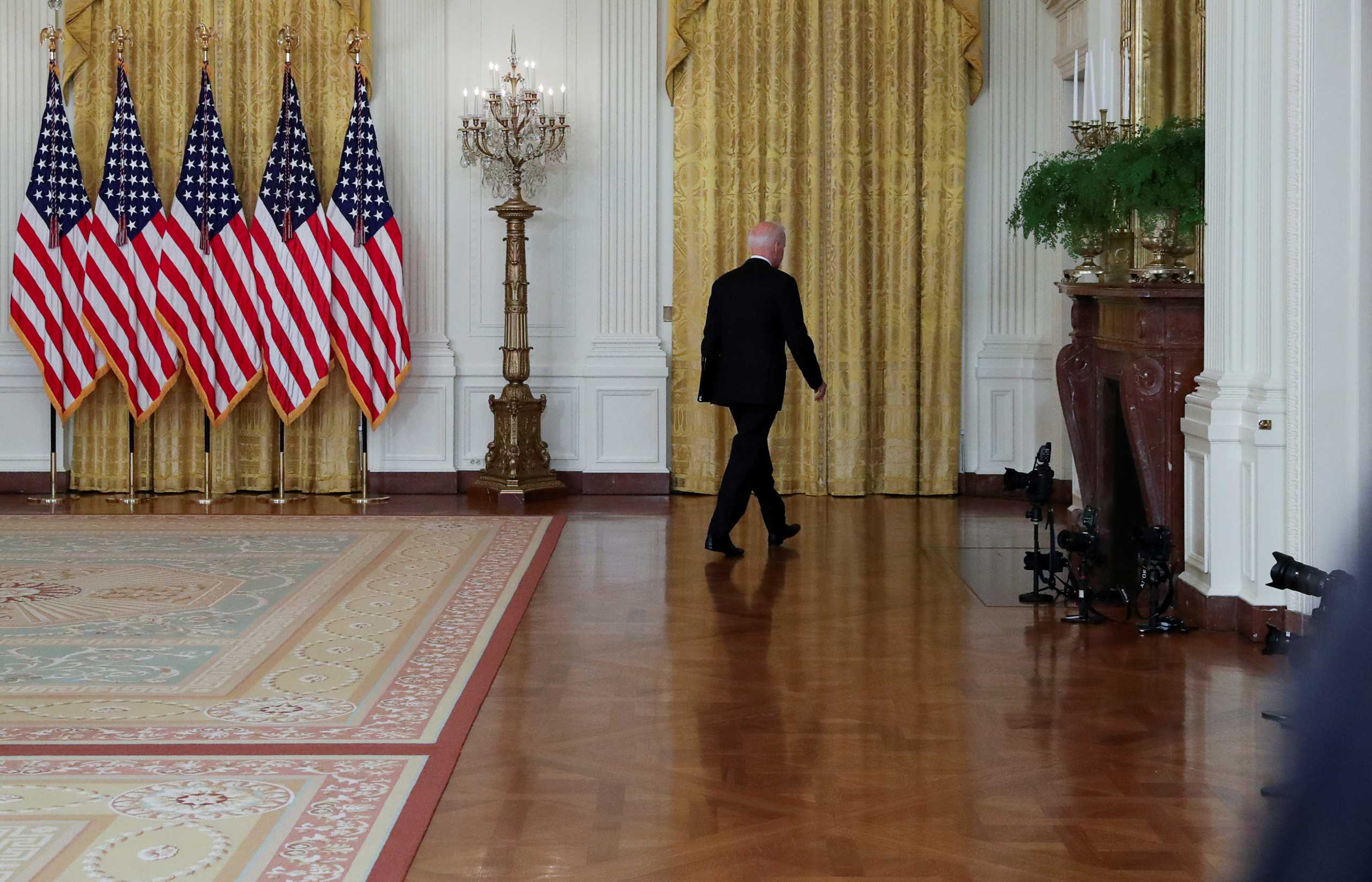 U.S. President Joe Biden departs after delivering remarks on the crisis in Afghanistan from the East Room at the White House in Washington, U.S., August 16, 2021. REUTERS