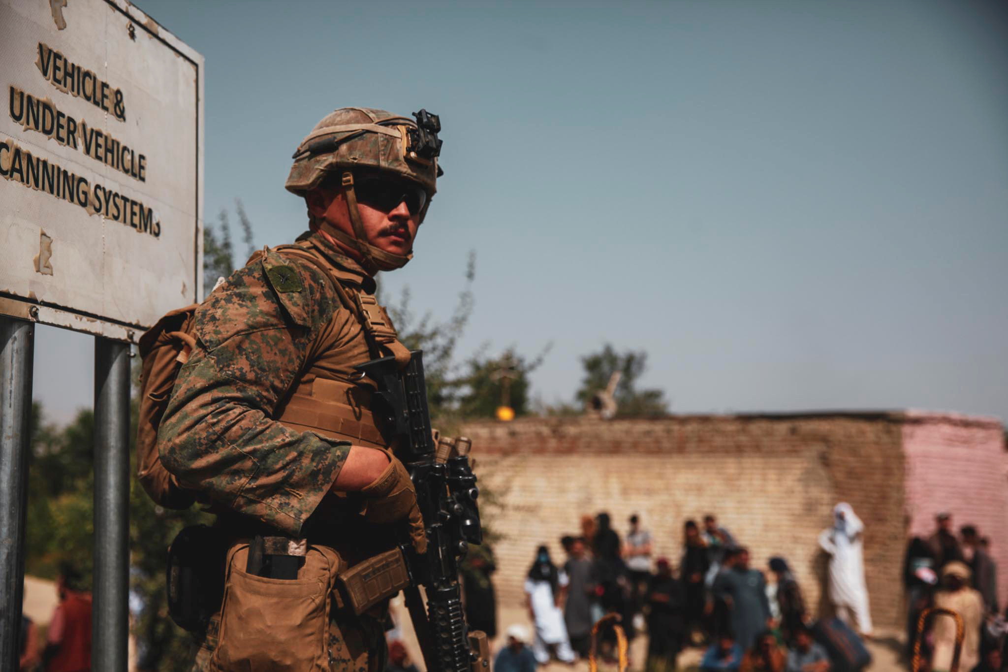 A U.S. Marine assigned to 24th Marine Expeditionary Unit provides security during an evacuation at Hamid Karzai International Airport, Afghanistan, August 18, 2021. Picture taken August 18, 2021. U.S. Marine Corps