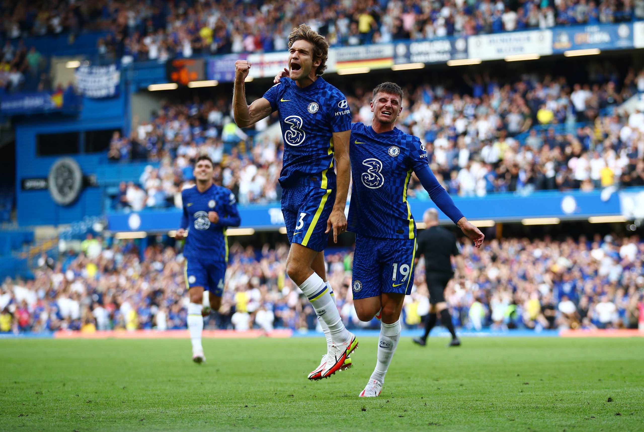 Soccer Football - Premier League - Chelsea v Crystal Palace - Stamford Bridge, London, Britain - August 14, 2021 Chelsea's Marcos Alonso celebrates scoring their first goal with Mason Mount REUTERS