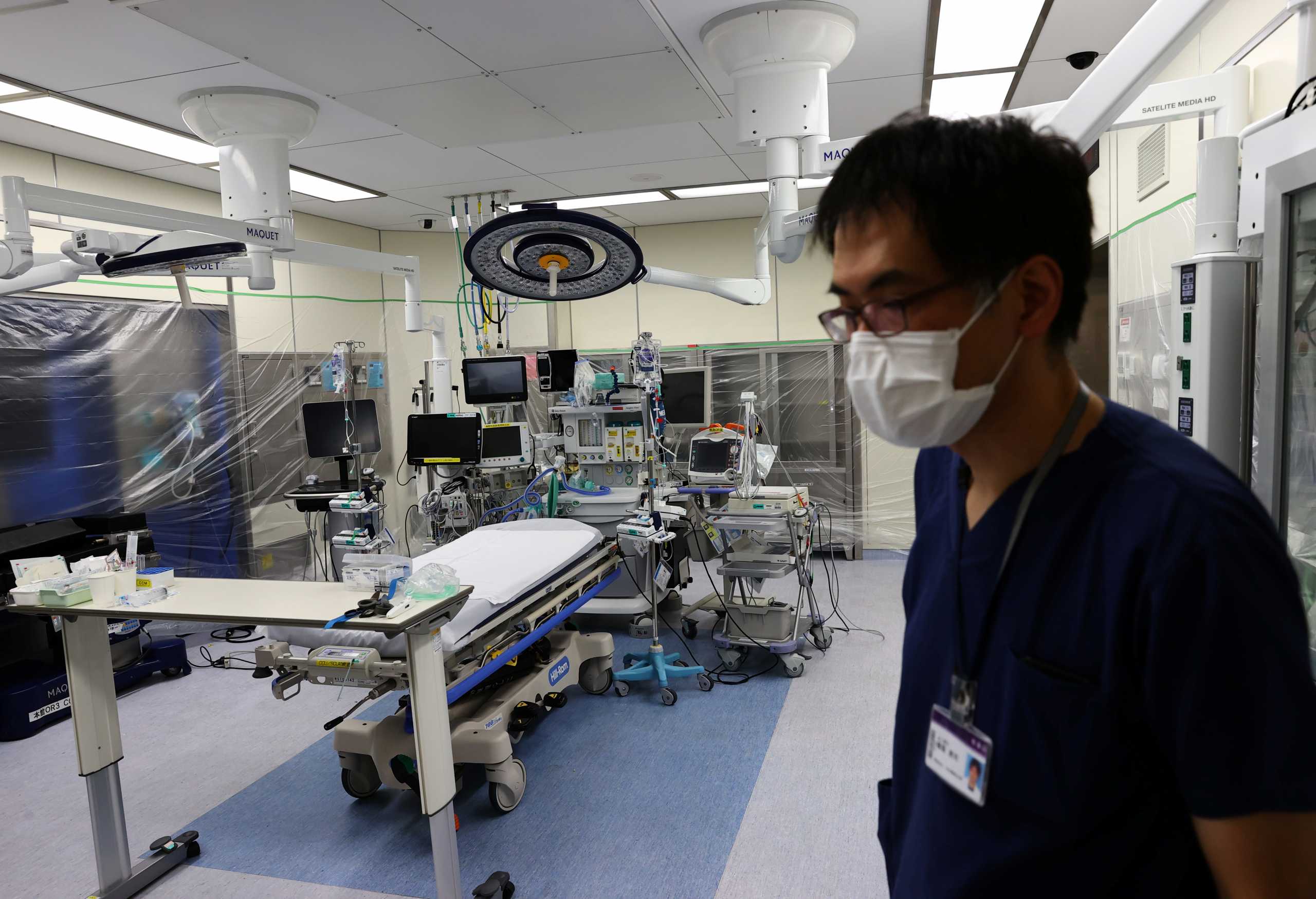 Nippon Medical School Hospital's ICU doctor Shoji Yokobori stands in the ICU which is covered with plastics to prevent the spread of coronavirus disease (COVID-19) at the hospital in Tokyo, Japan, August 1, 2021. Picture taken on August 1, 2021.  REUTERS