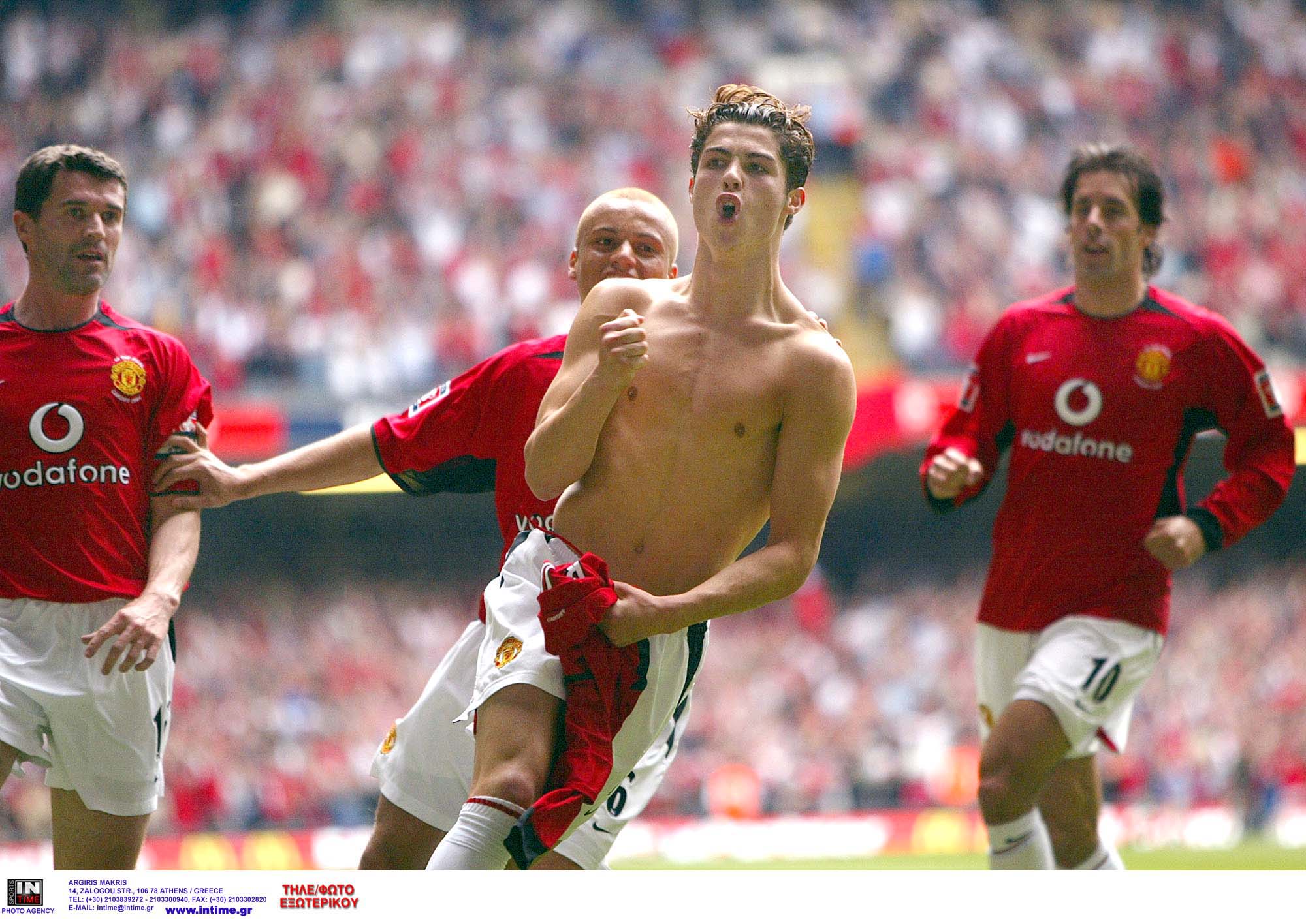 Manchester United's Cristiano Ronaldo, celebrates after scoring the opening goal during the FA Cup final between Millwall and Manchester United at the Millennium Stadium in Cardiff, Wales, Saturday May 22, 2004. At left is Roy Keane, behind Ronaldo is Wes Brown and at right is Ruud van Nistelrooy. (AP Photo